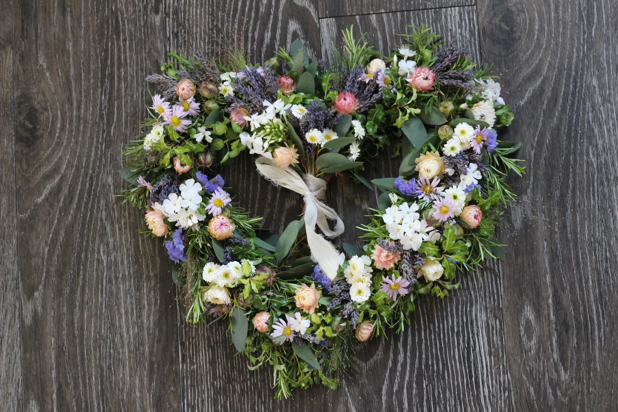 Heart-shaped funeral wreath with lavender and white daisies from Blue Hill Flora