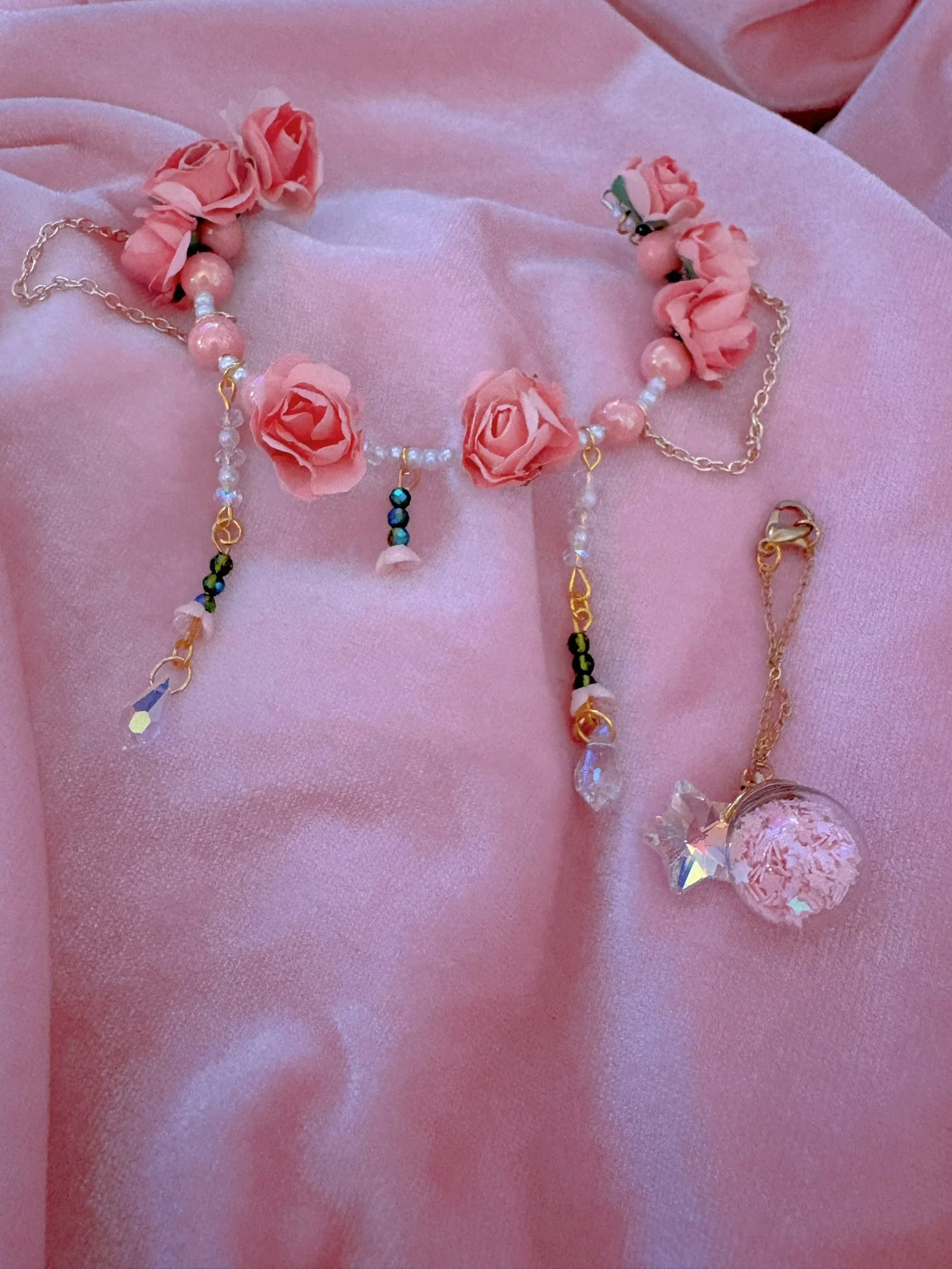 $35.00. 

Coral pink rose crown with dangling bead and gold chain details. Includes matching pink star bauble necklace. 

Adjustable, best fits size 7/8 through 9/10 heads.