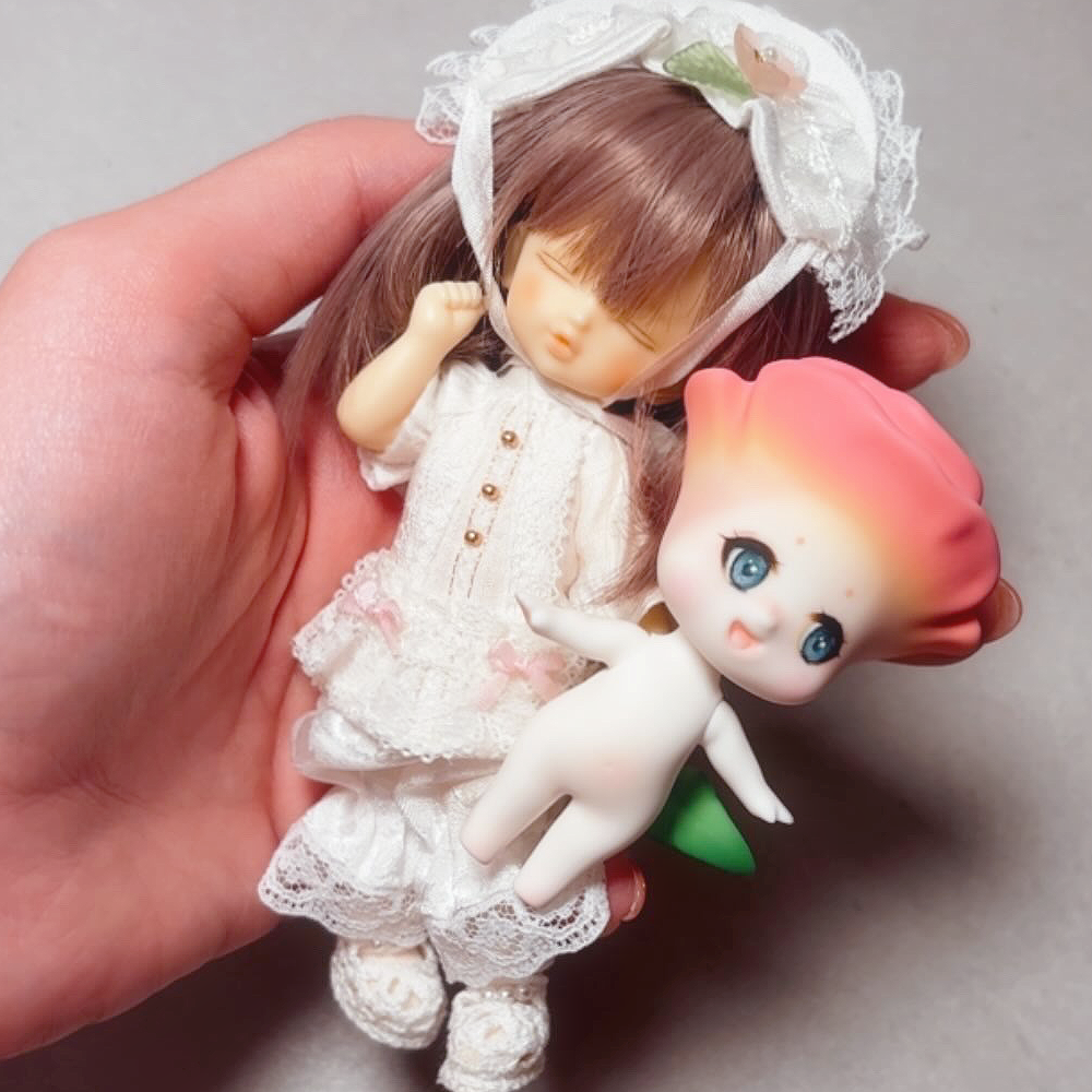 Volks Rei-Tenshi ball jointed doll wearing Cocoriang outfit and posing with Cocoriang Rosette Resin Rose 2026 exclusive doll