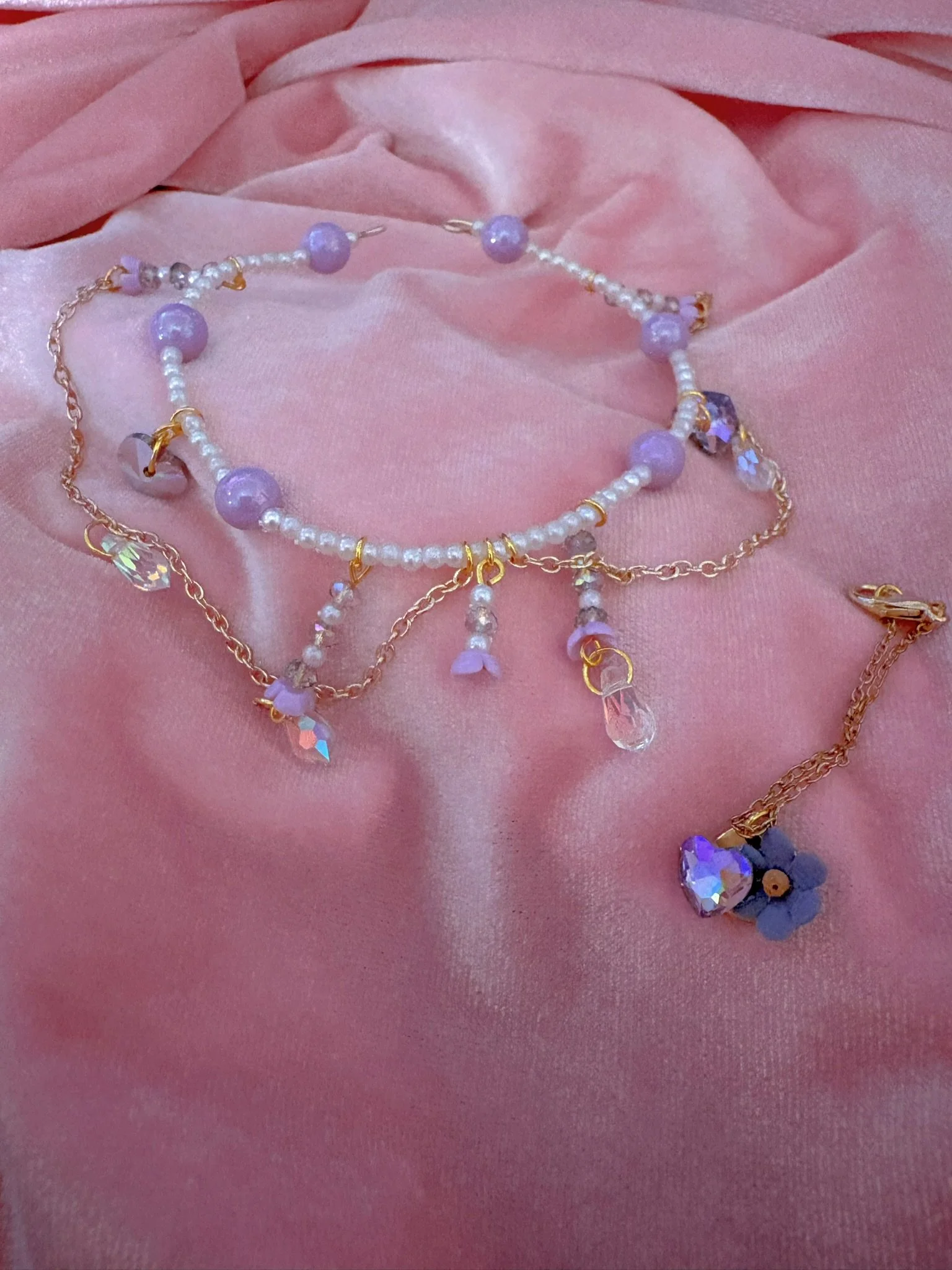 $30.00. 

Crystal and pearl crown with dangling crystals. Includes matching crystal heart and flower necklace. 

Adjustable, best fits dolls with size 7/8 through size 9/10 heads.