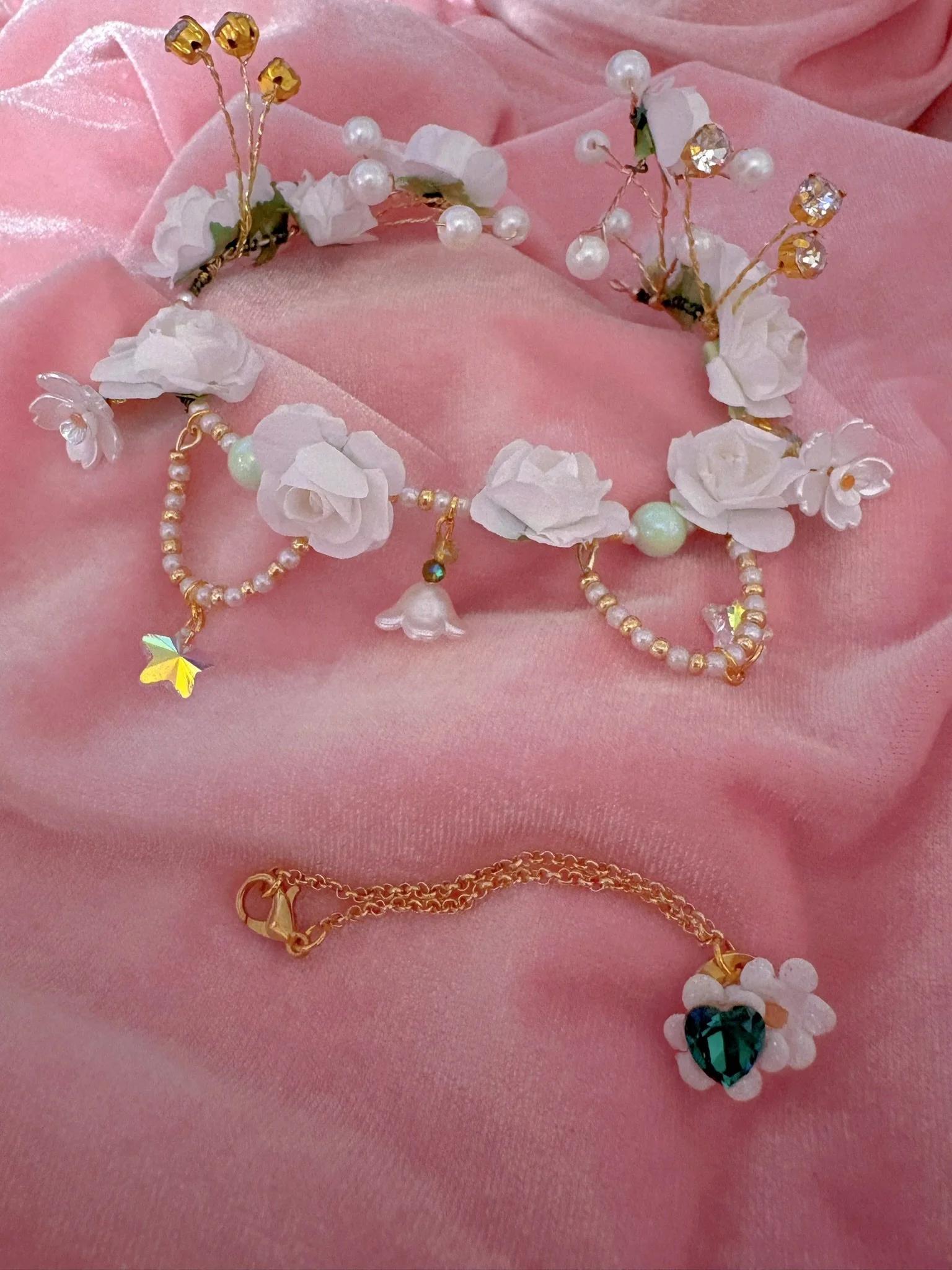 $35.00. 

White rose crown with crystals, pearls, and dangling bead details. Includes matching crystal heart and flower necklace. 

Adjustable, best fits dolls with size 7/8 through size 9/10 heads.