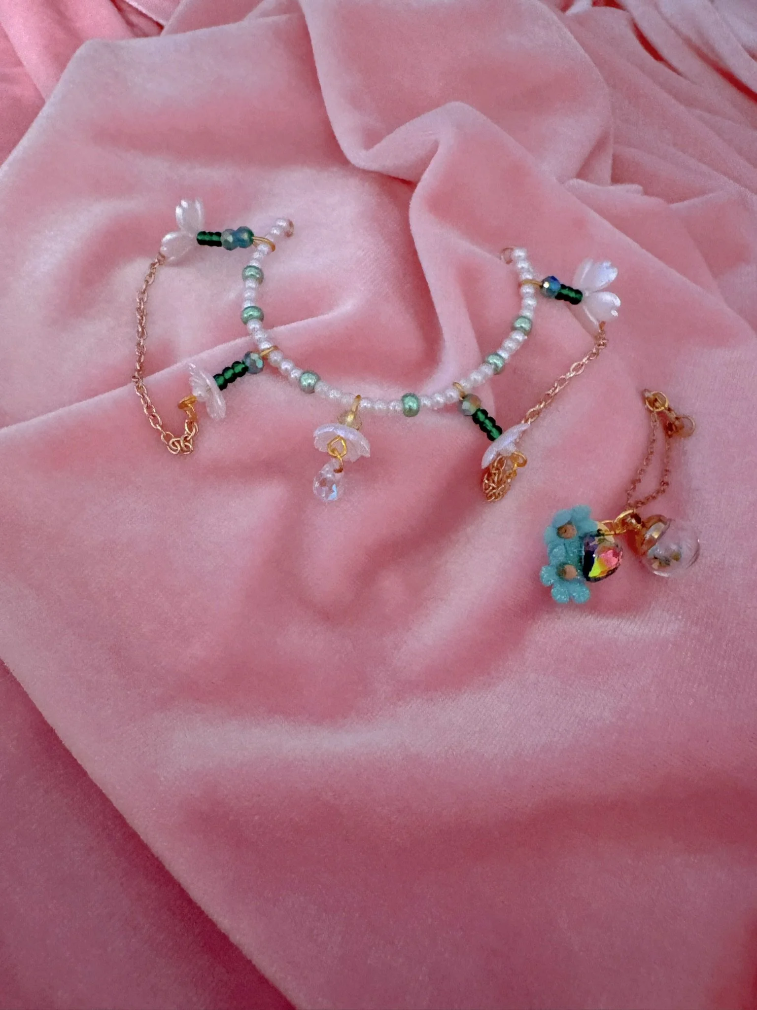 $20.00. 

Crystal bead and pearl tiara with dainty flower bead and gold chain details. Includes matching crystal heart and flower necklace. 

Adjustable, best fits dolls with size 3/4 through size 5/6 heads.