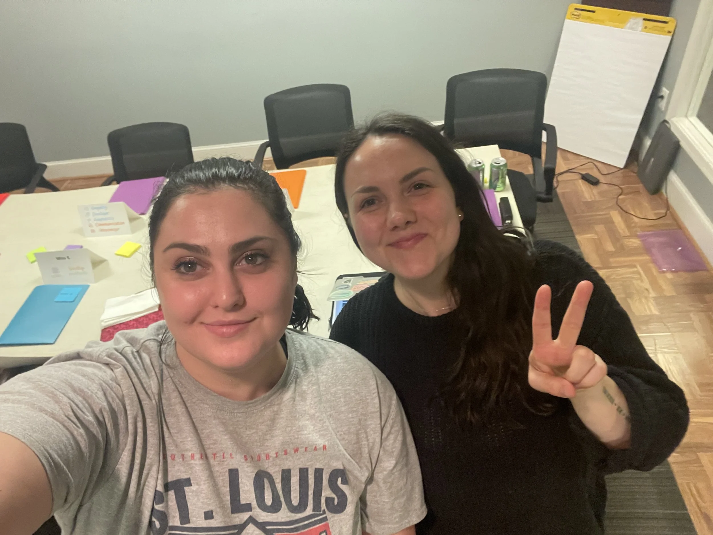 Kinship coaches Jules and Sara take a late night selfie finishing up agenda planning for an in-person event in Pennsylvania. 
