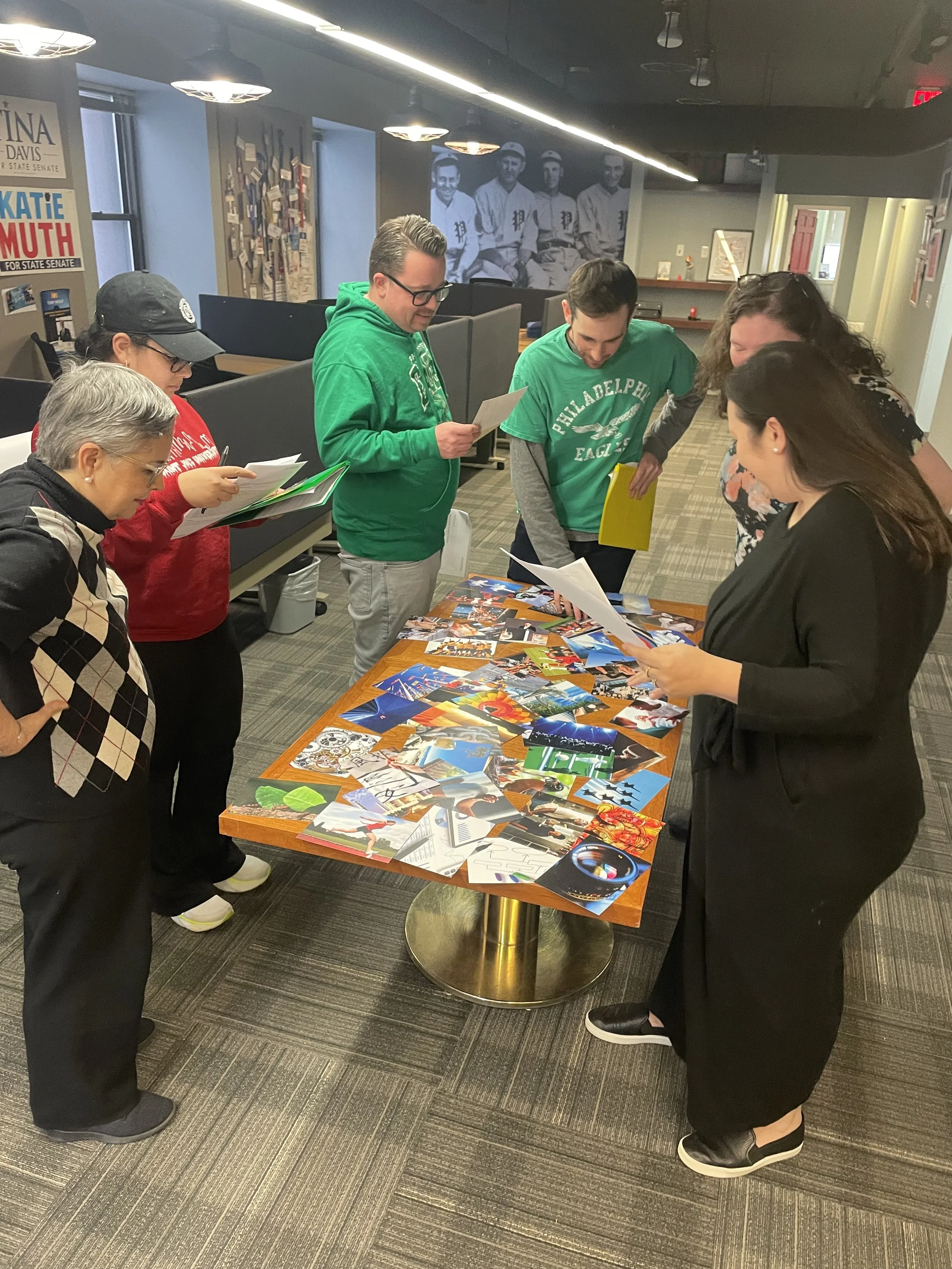 Participants sort through colorful cards and images that represent their strengths as individuals and as a team.