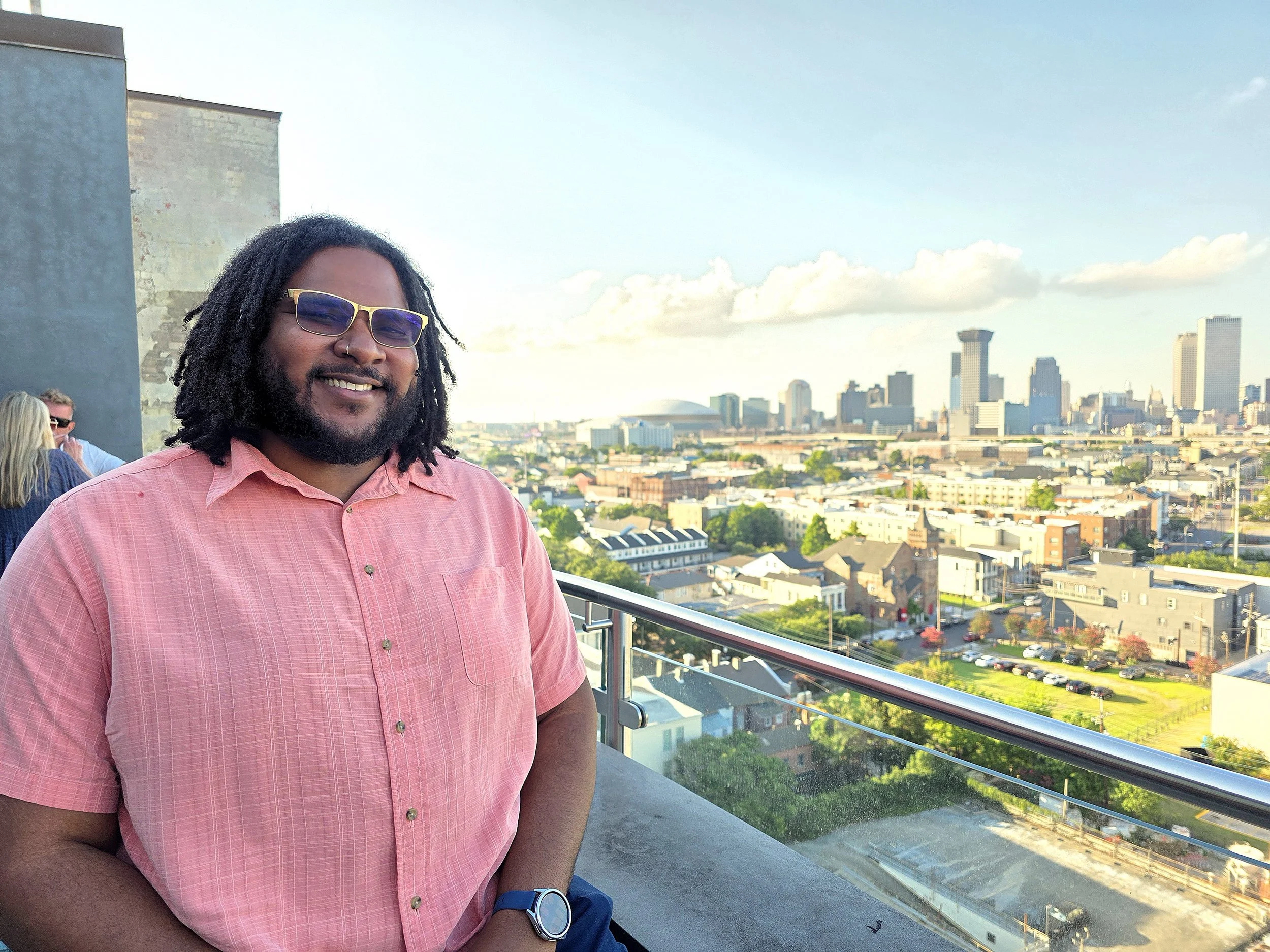 Headshot of Solomon Matthews against a city backdrop