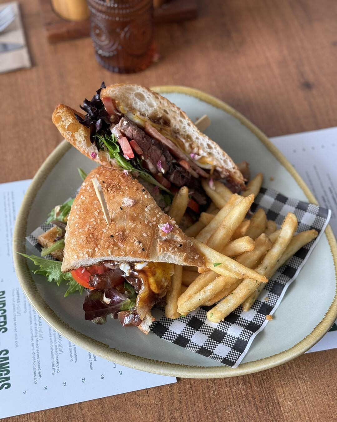 Friday = Steak Sandwich 👌
Dripping with flavour&hellip;tender 150g rib fillet, caramelised onion, fried egg, bacon, tomato, cheese, lettuce, aioli &amp; bbq sauce 🤤 
.
.
.
#cafelunch #brisbanecafe #brisbanefoodie #steaksandwich