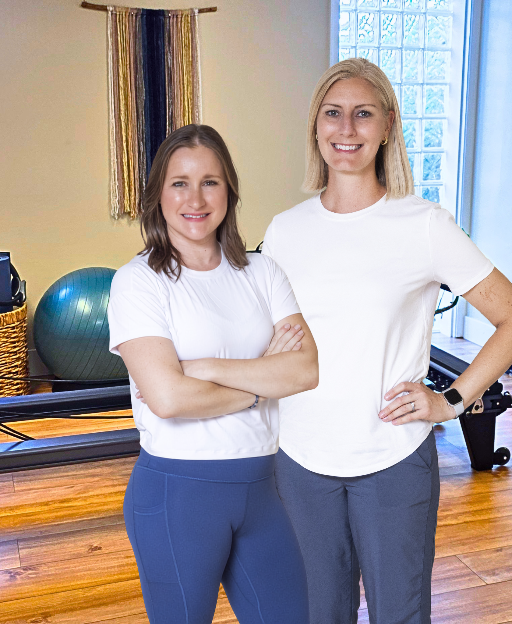 Two women stand wearing athletic apparel.