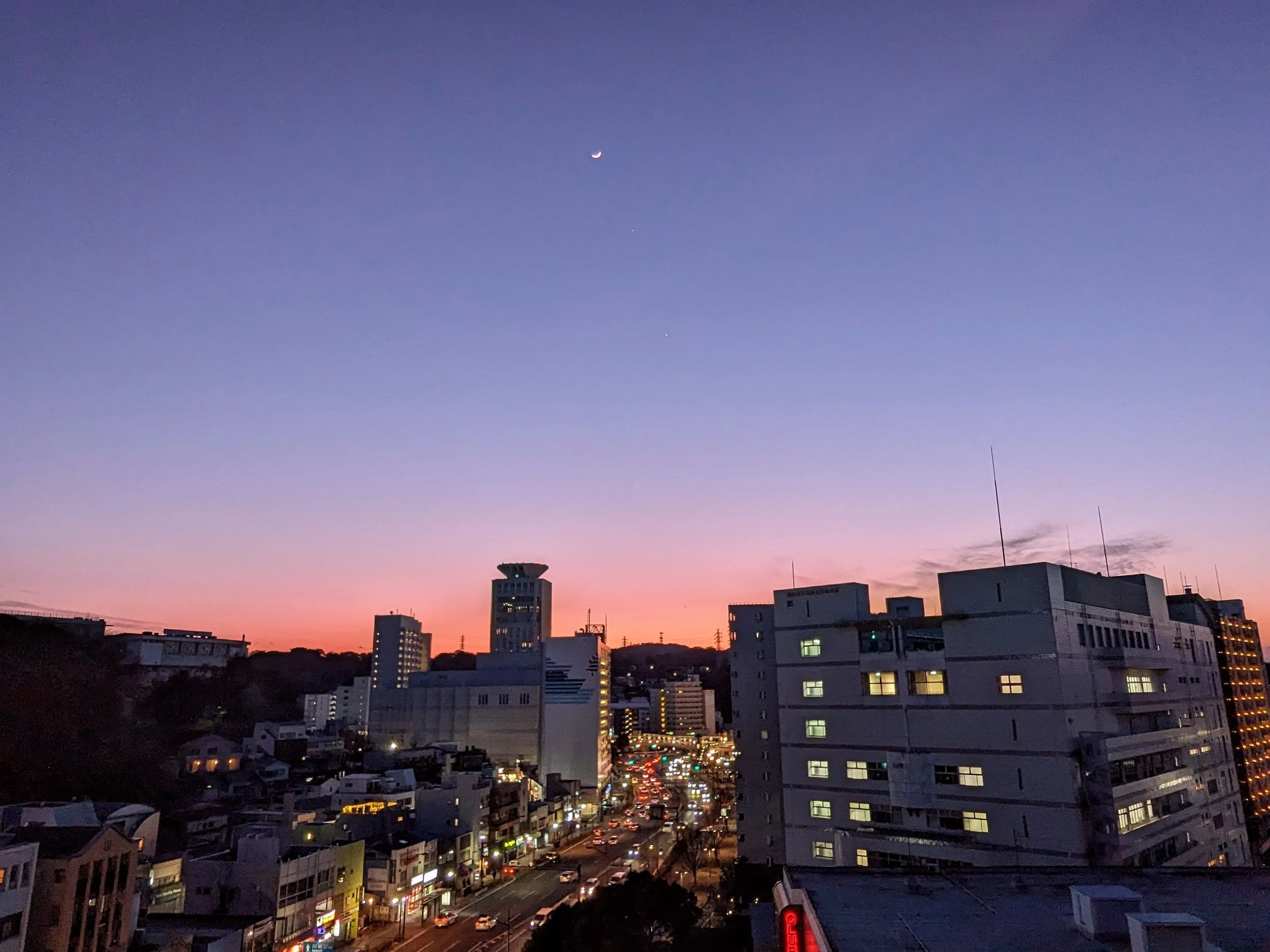 Yokosuka City bathed in evening violet, as seen from my 11th-floor Japanese apartment balcony