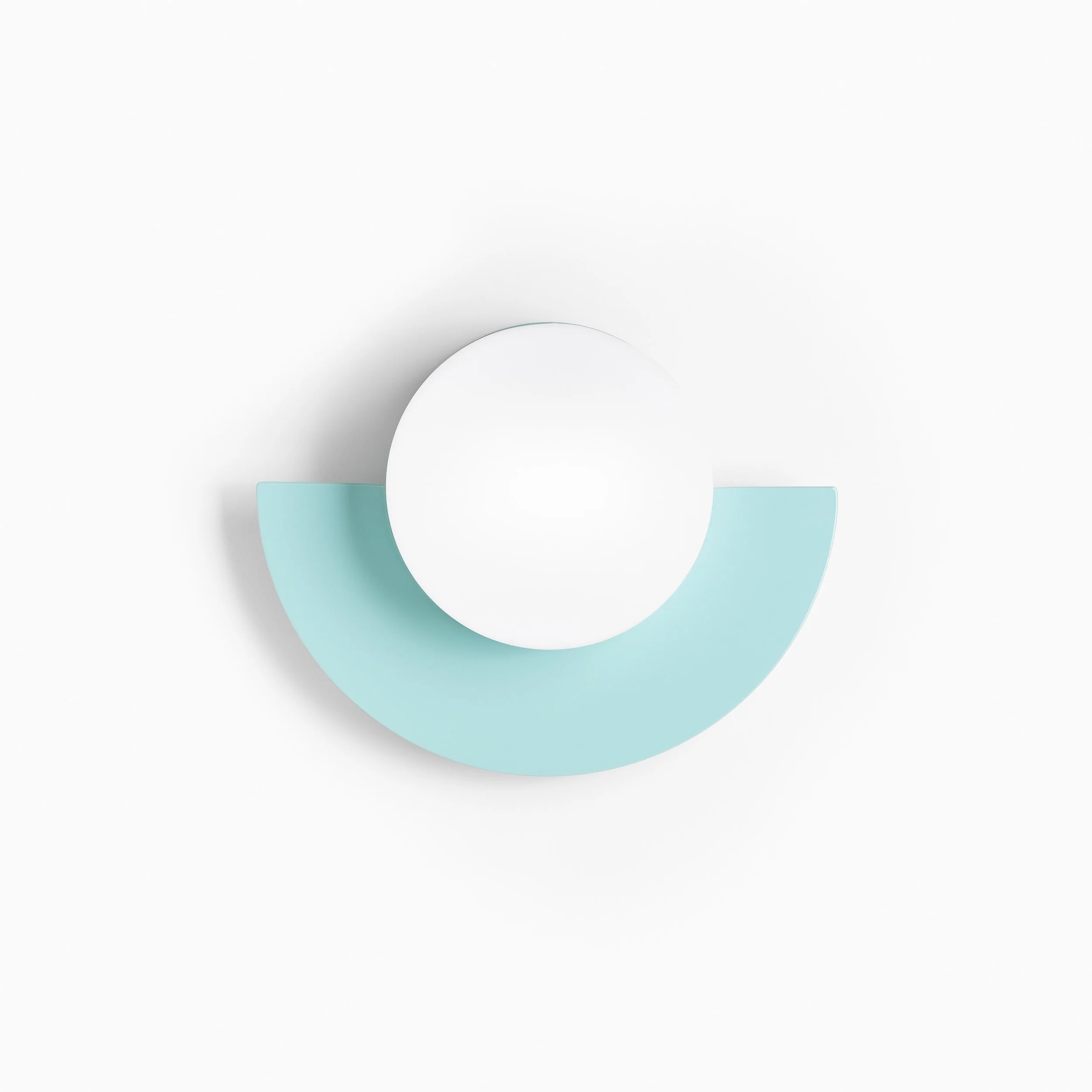 Minimalist composition featuring a white circular object centered on a light blue arc, set against a white background.