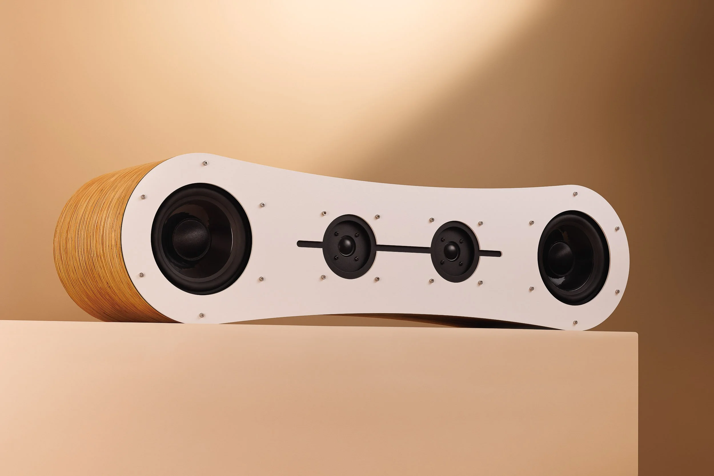 Fourier Acoustics Boomslang stereo speaker bar with hourglass layered wood body, white baffle, and four drivers on plinth