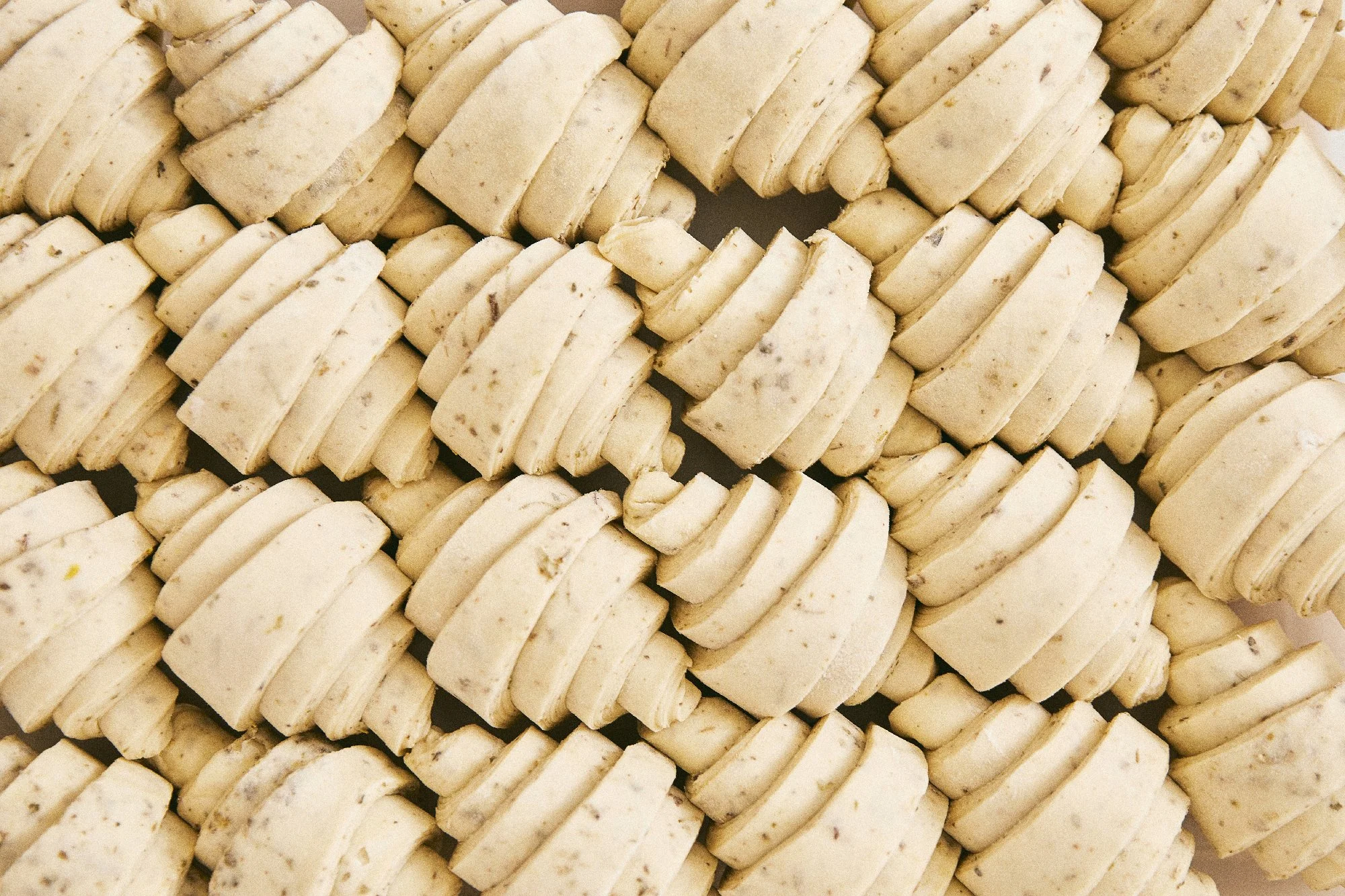 Herbed croissant dough shaped into croissants