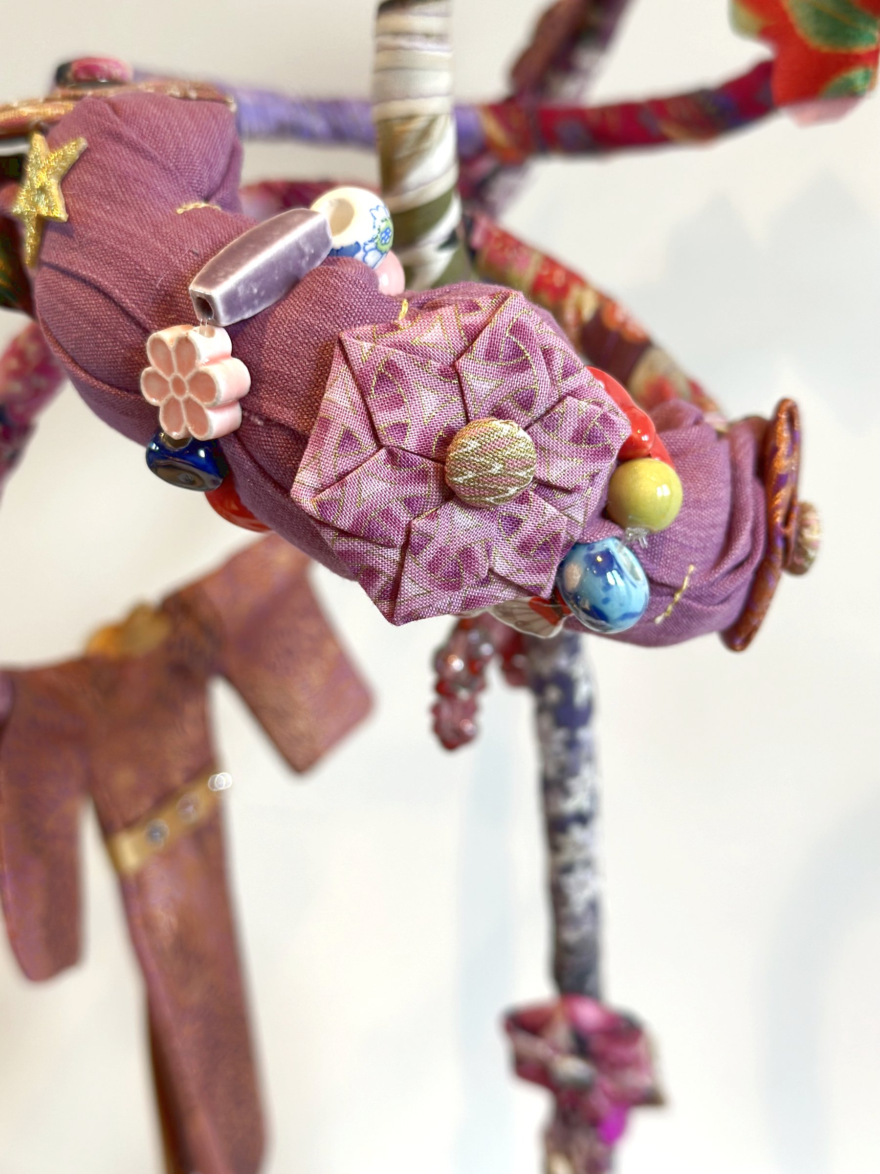 Japanese Garden (Spring), textile sculpture in spring blossom colours showing detail of abstract curves.