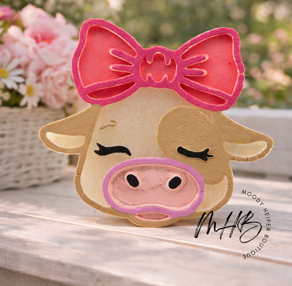 tan cow with bow.png