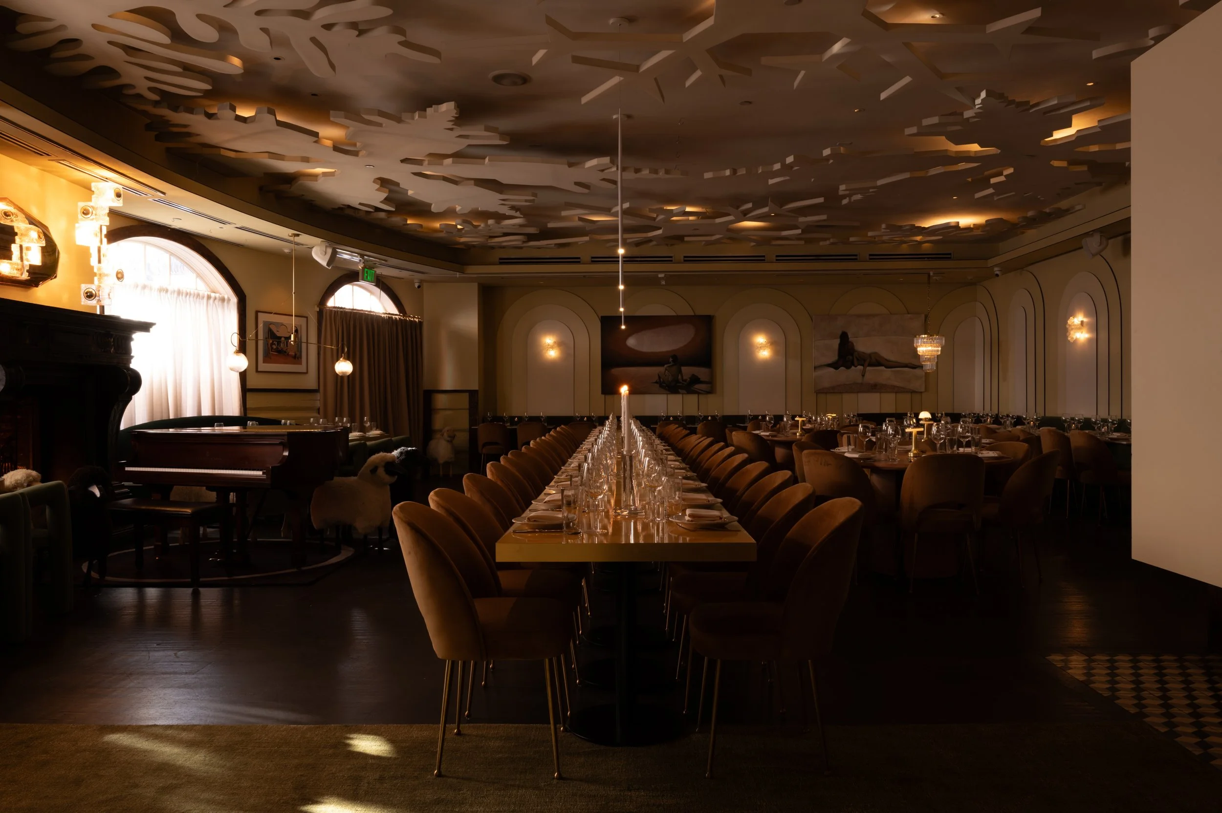 A wide view of The Snow Lodge dining room with a long central table