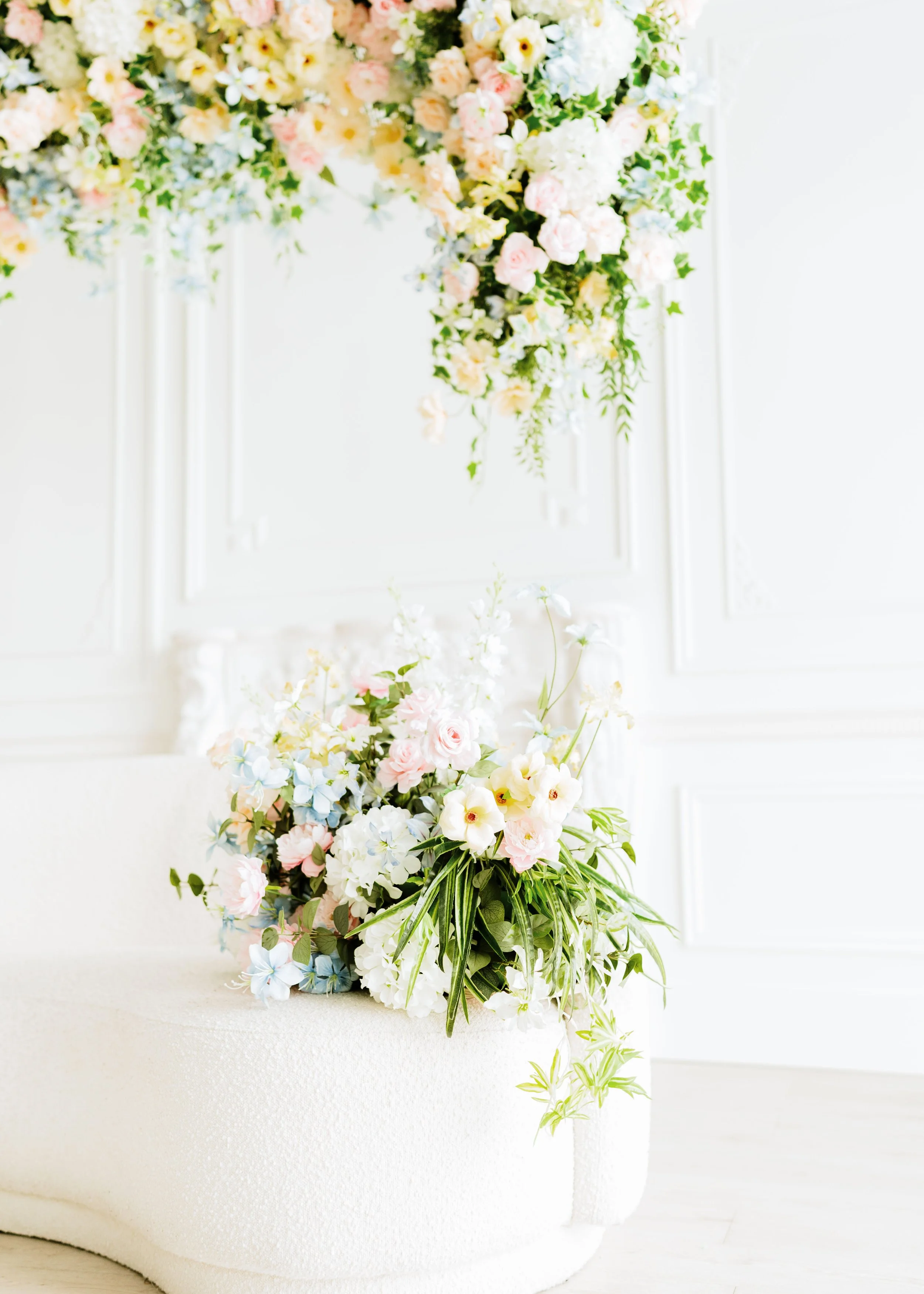 Soft Bloom Canopy – Mother’s Day
Available April 4–May 18
Set up in front of the French moulding wall, and the hanging florals cannot be moved.
