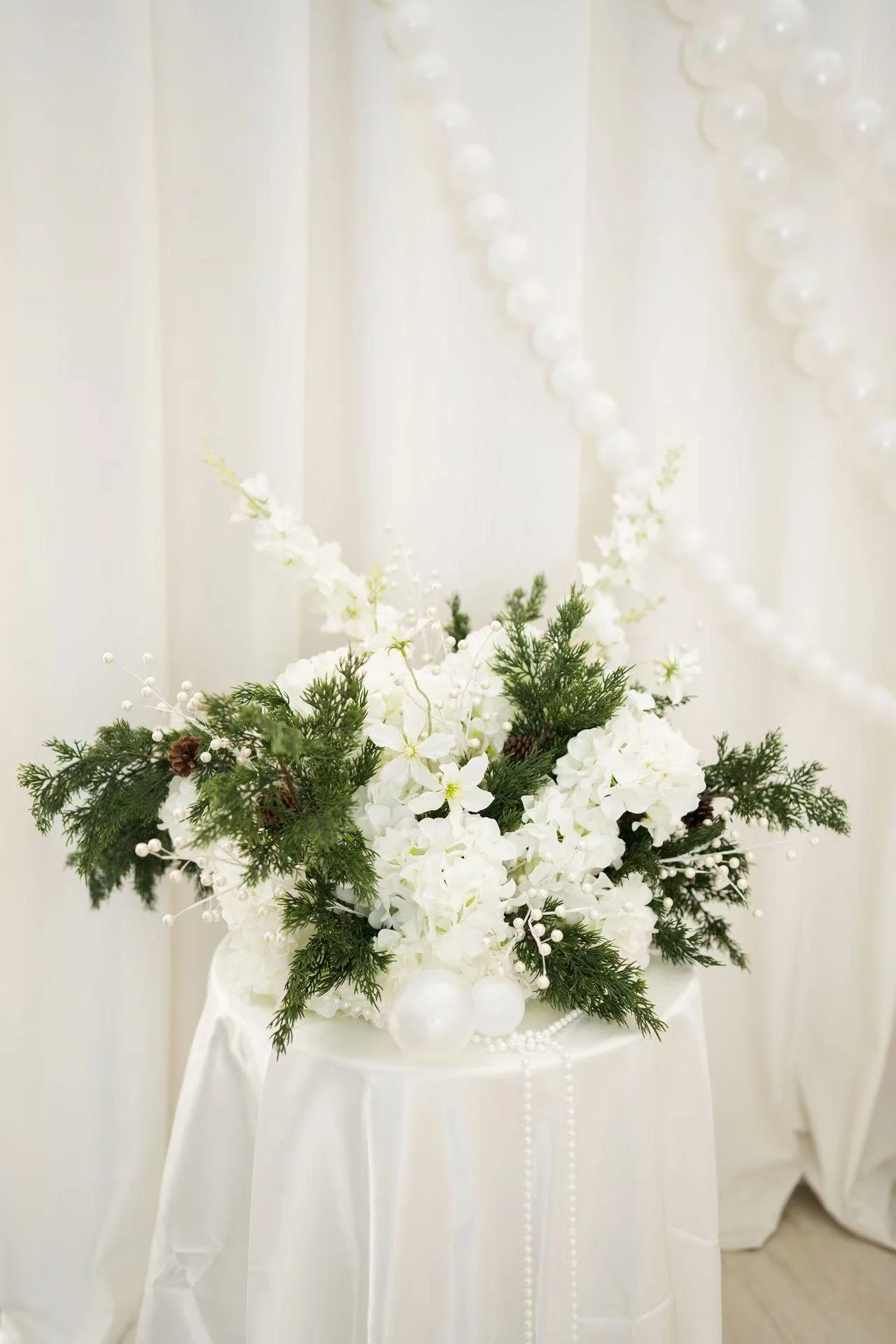 Winter Pearls - Available Oct 17-Dec 31, located in front of the ivory draping. AI Concept, final Setup May Vary.