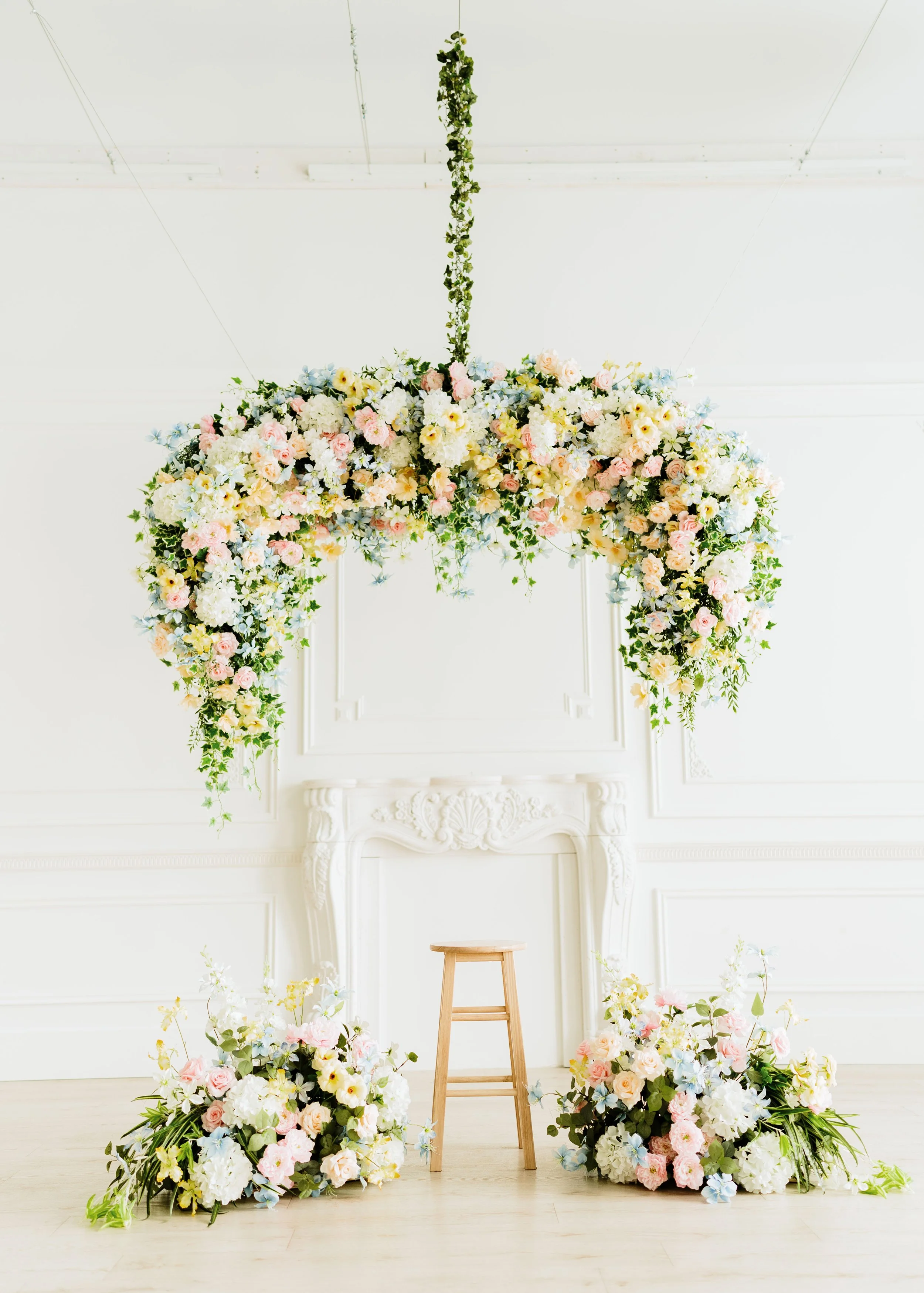 Soft Bloom Canopy – Mother’s Day
Available April 4–May 18
Set up in front of the French moulding wall, and the hanging florals cannot be moved.