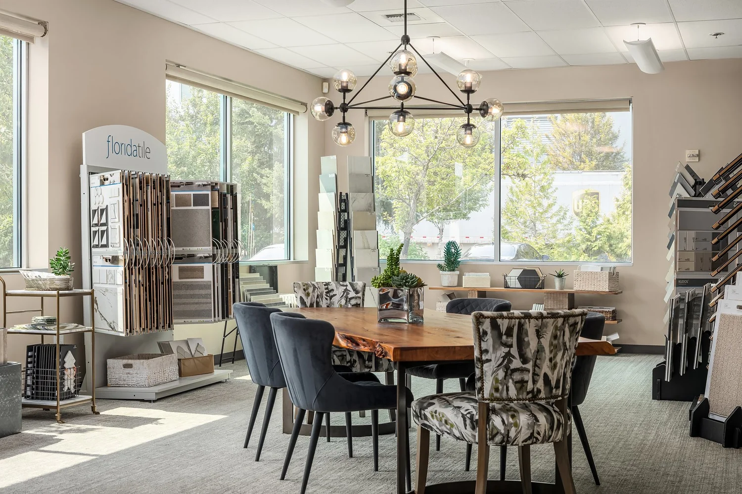 Design consultation table surrounded by finish samples and natural light