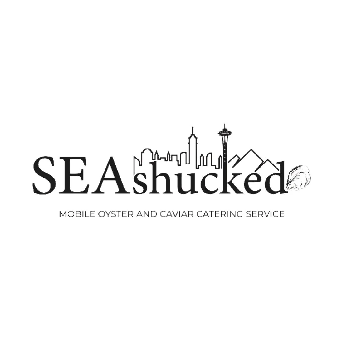 Logo for SEAshucked, a mobile oyster and caviar catering service, featuring a city skyline with the Space Needle, mountains, and a shell illustration.