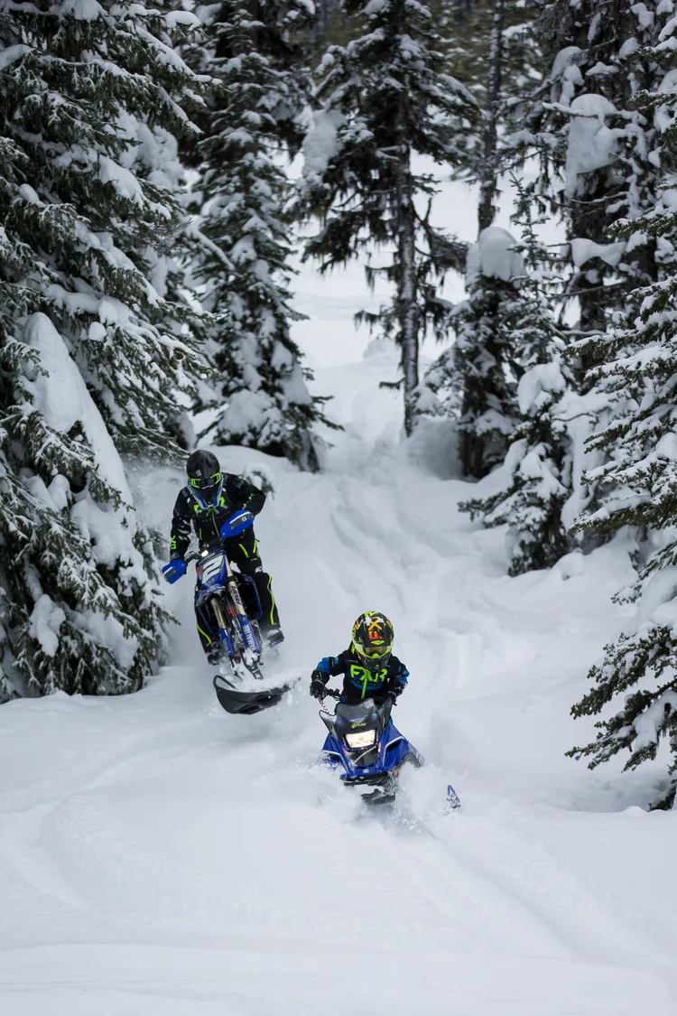Family snowmobiling in Williams Lake, British Columbia