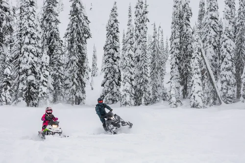 Family snowmobiling in Cranbrook, British Columbia
