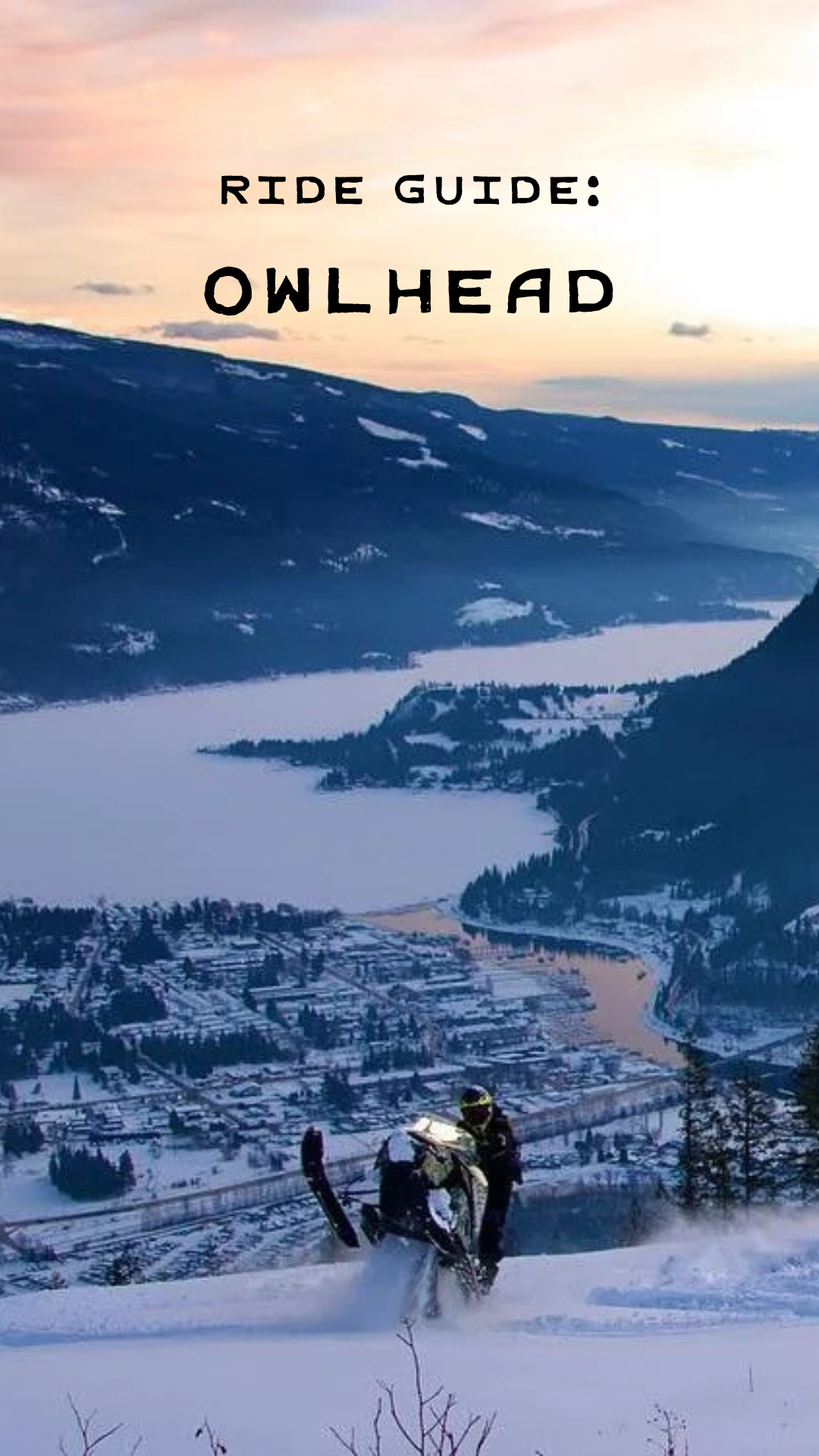 A snow-covered mountain landscape with a person riding a snowmobile in the foreground. A town can be seen in the valley below, with a large lake and mountain range in the background. The sky is partly cloudy with a sunset or sunrise.