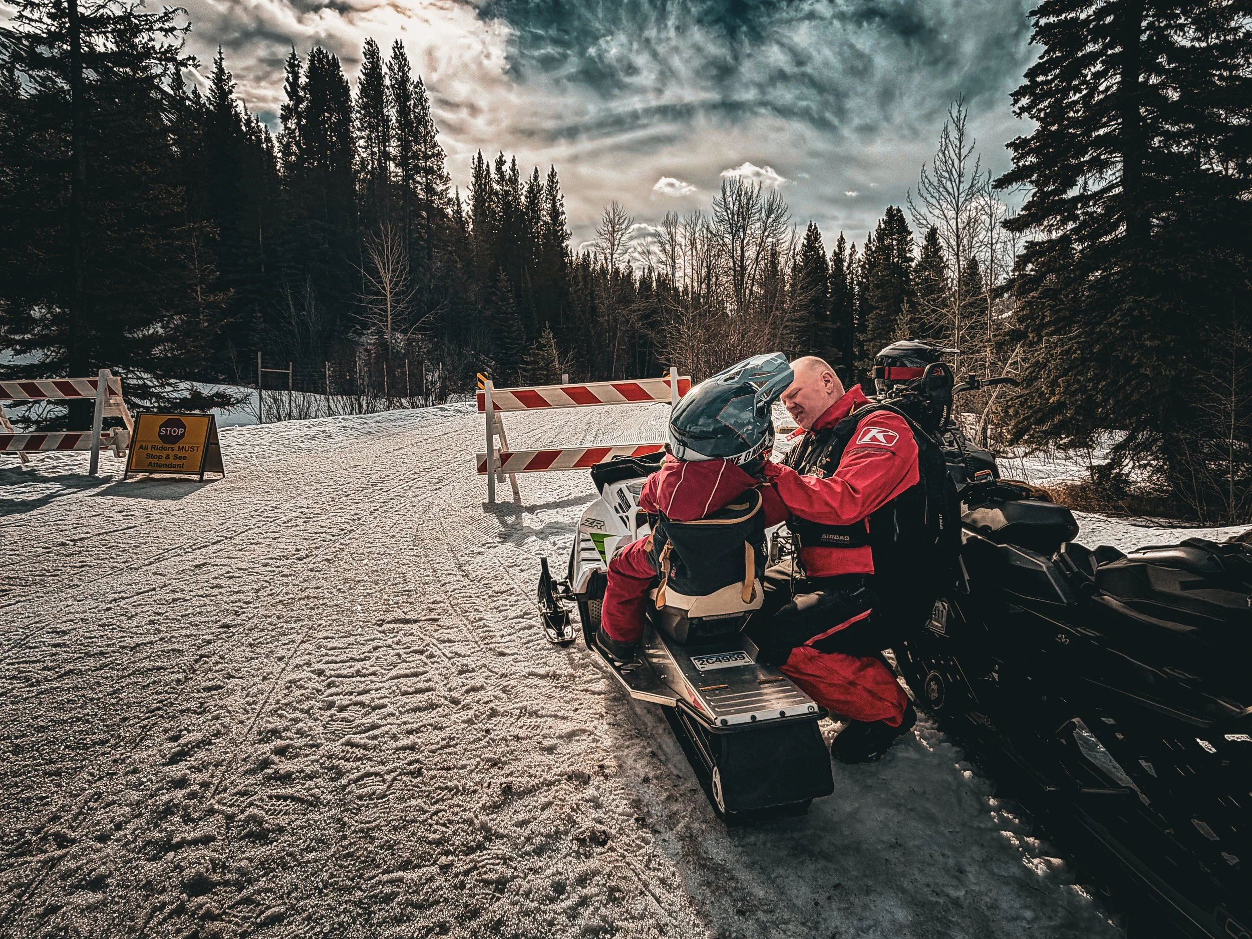 Family snowmobiling in Fernie, British Columbia