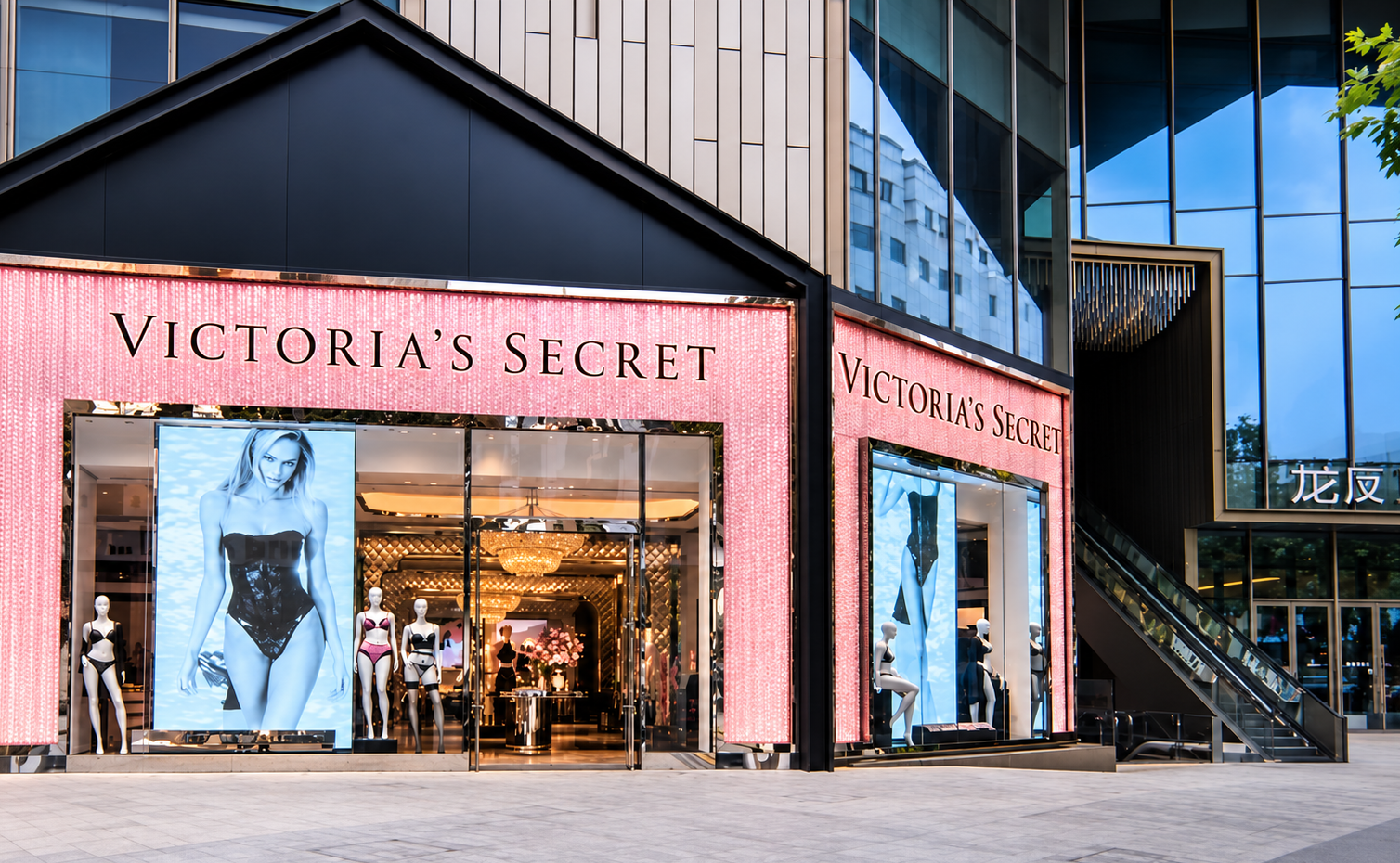 Pink Victoria’s Secret storefront at dusk.png