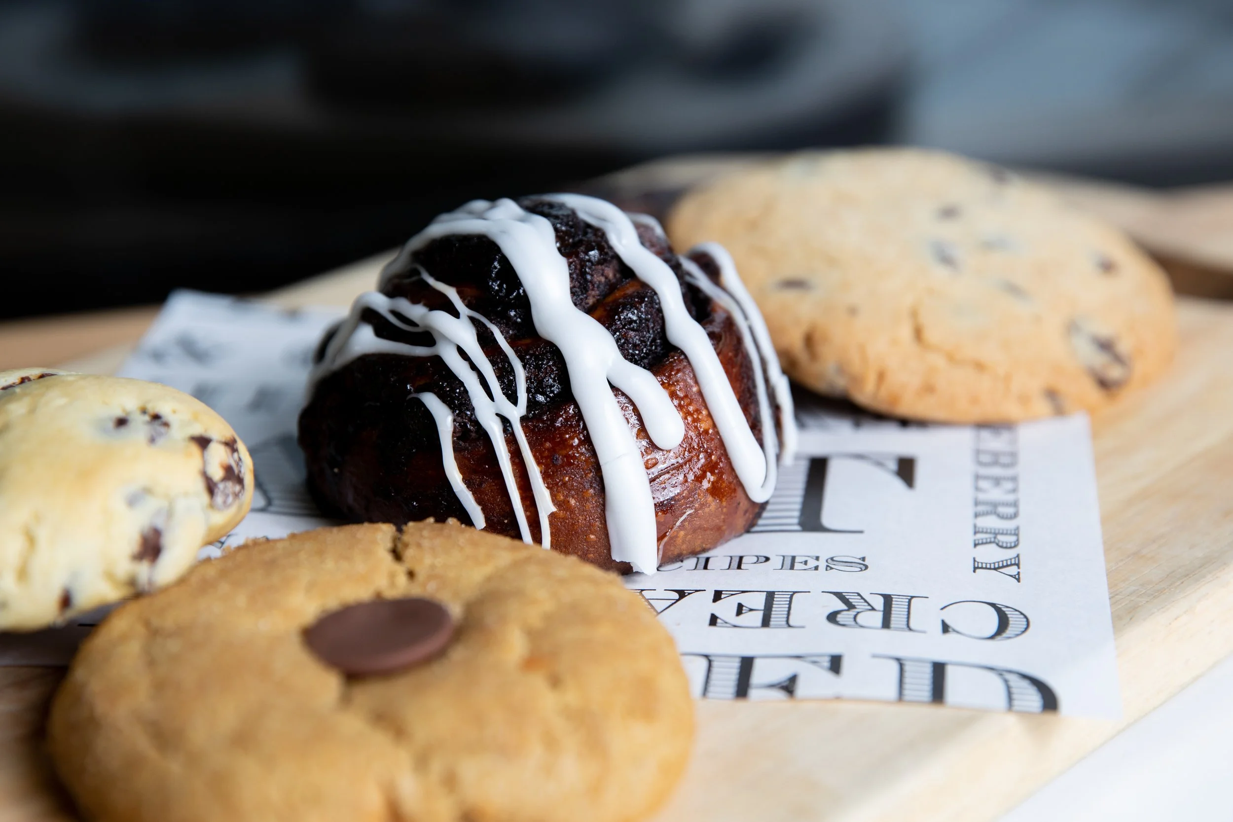 Chocolate babka with cookies in the fore and background