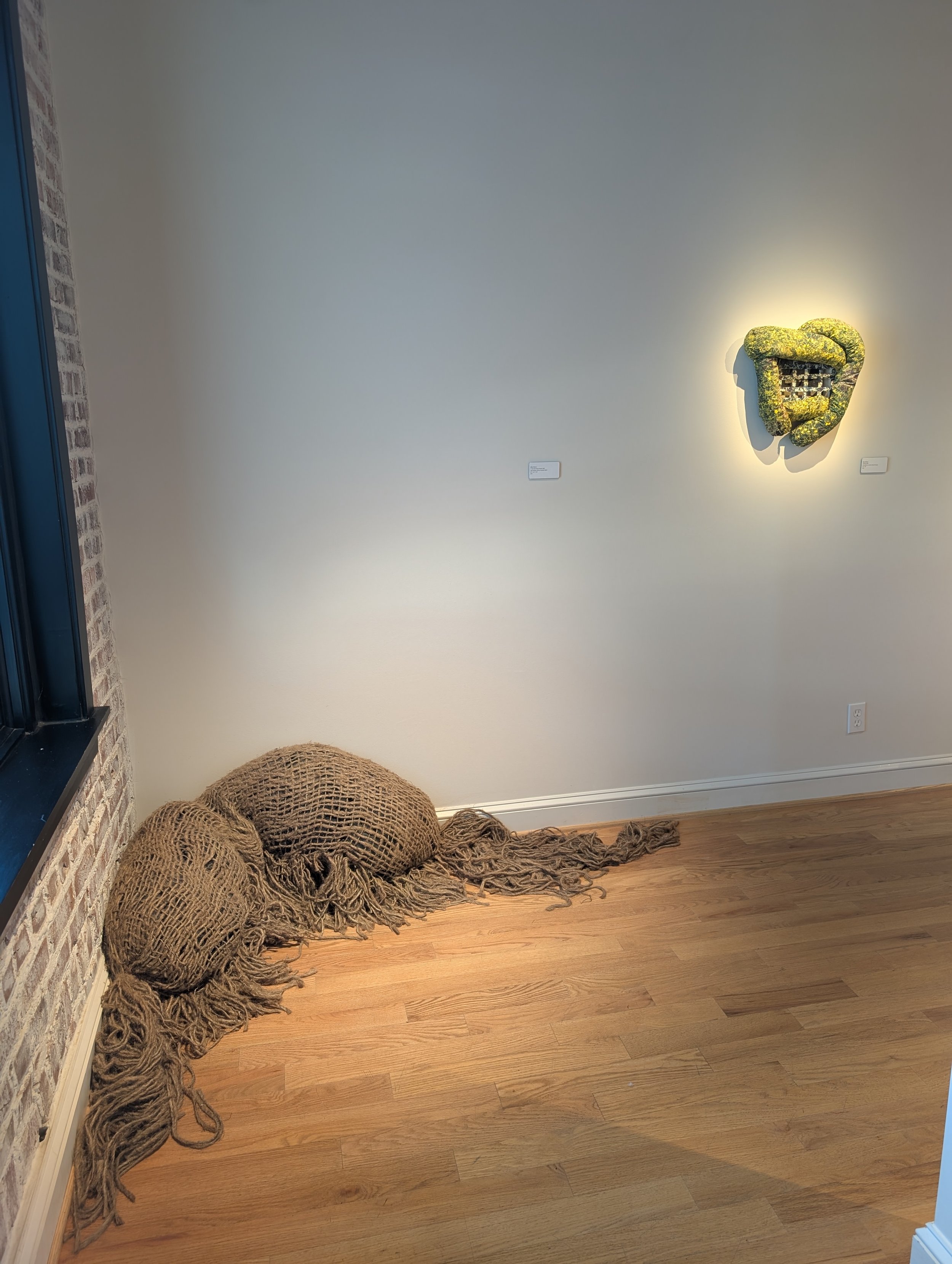 "If I Lay Here Long Enough" by Milan Warner (left)
"Holding" by Eliza Clifford (right)
