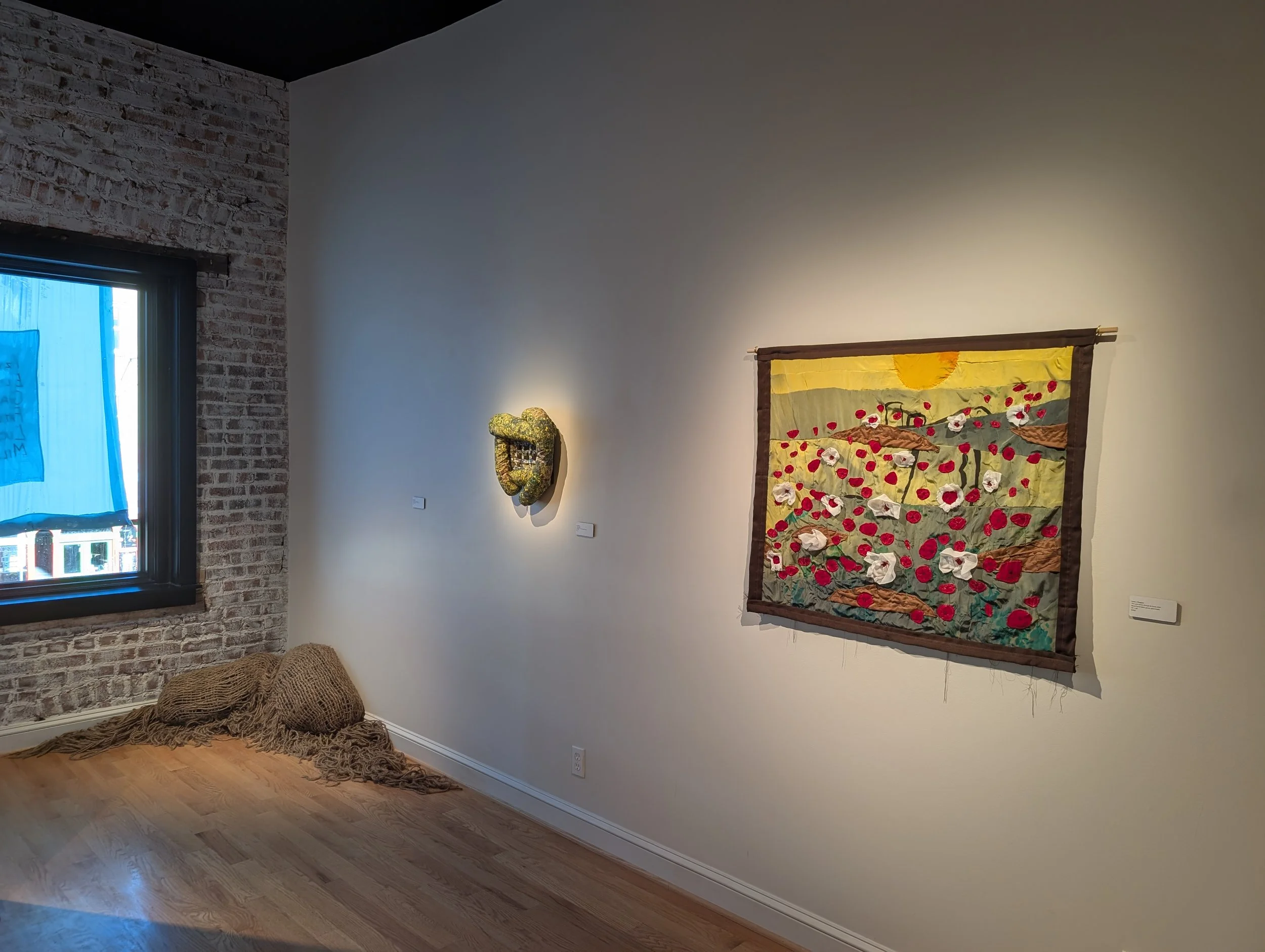"If I Lay here Long Enough" by Milan Warner (left floor)
"Looking" by Eliza Clifford (middle)
"The Land Grows Through its Scars" by Lucas J Rougeux (right)