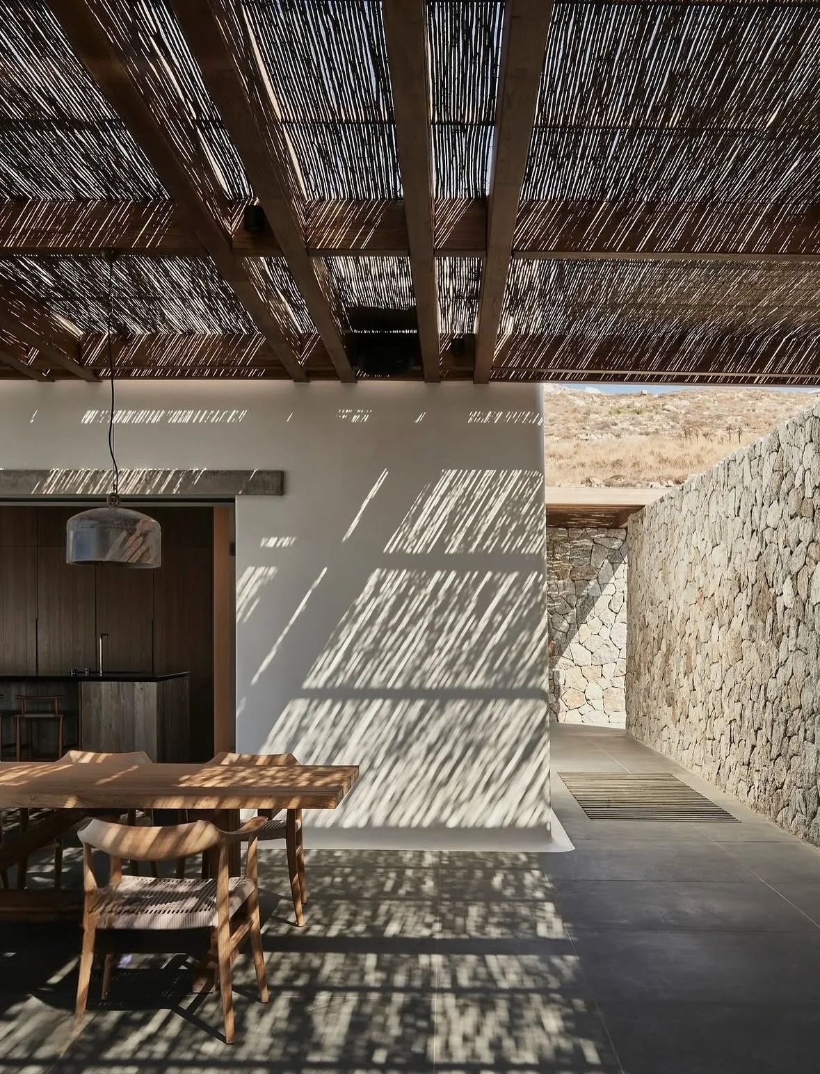 When architecture speaks the language of nature

This modern Mediterranean home blends stone, wood, and sunlight into pure harmony. 

The bamboo pergola casts the most beautiful shadows, turning every corner into living art. Minimal yet warm, raw yet