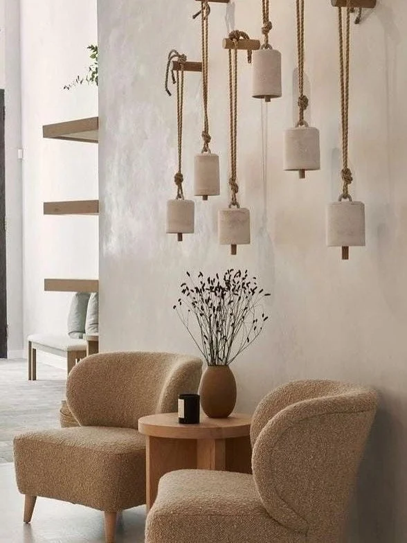 Earthy textures. Sculptural forms. A dialogue between light and materiality.

Each element &mdash; from weathered stone to hand-turned wood and soft linen &mdash; speaks to the quiet poetry of natural design. Spaces that feel calm, tactile, and timel