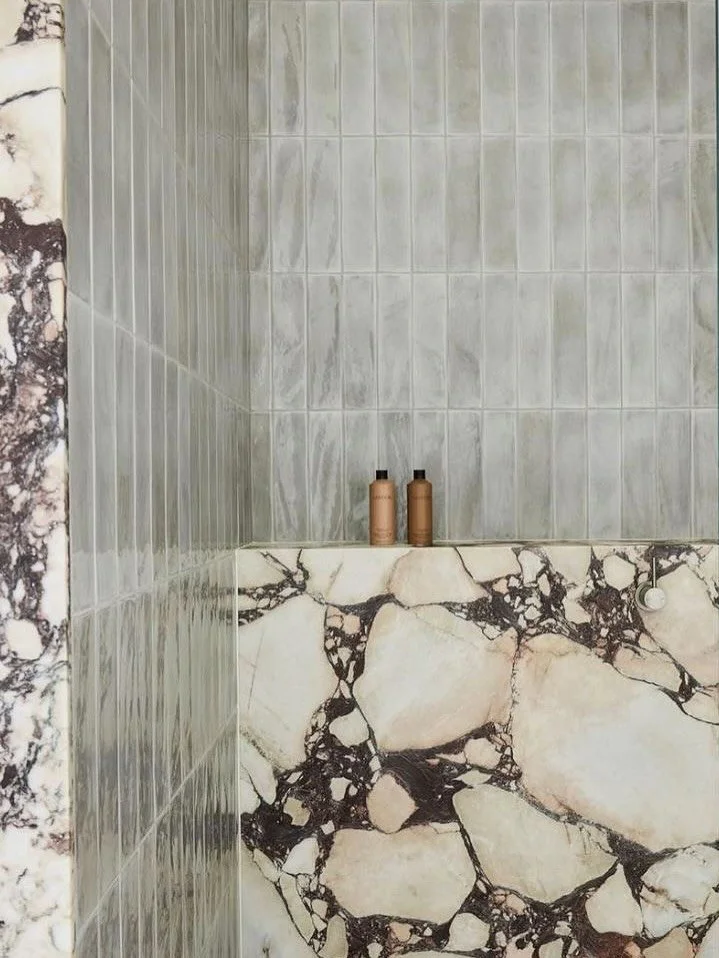 THE ART OF CONTRAST

There&rsquo;s something timeless about the dialogue between marble and handmade tile &mdash; smooth meets textured, polished meets raw.
⁠In the shower, this balance transforms function into a ritual: the stone anchors, the tile b