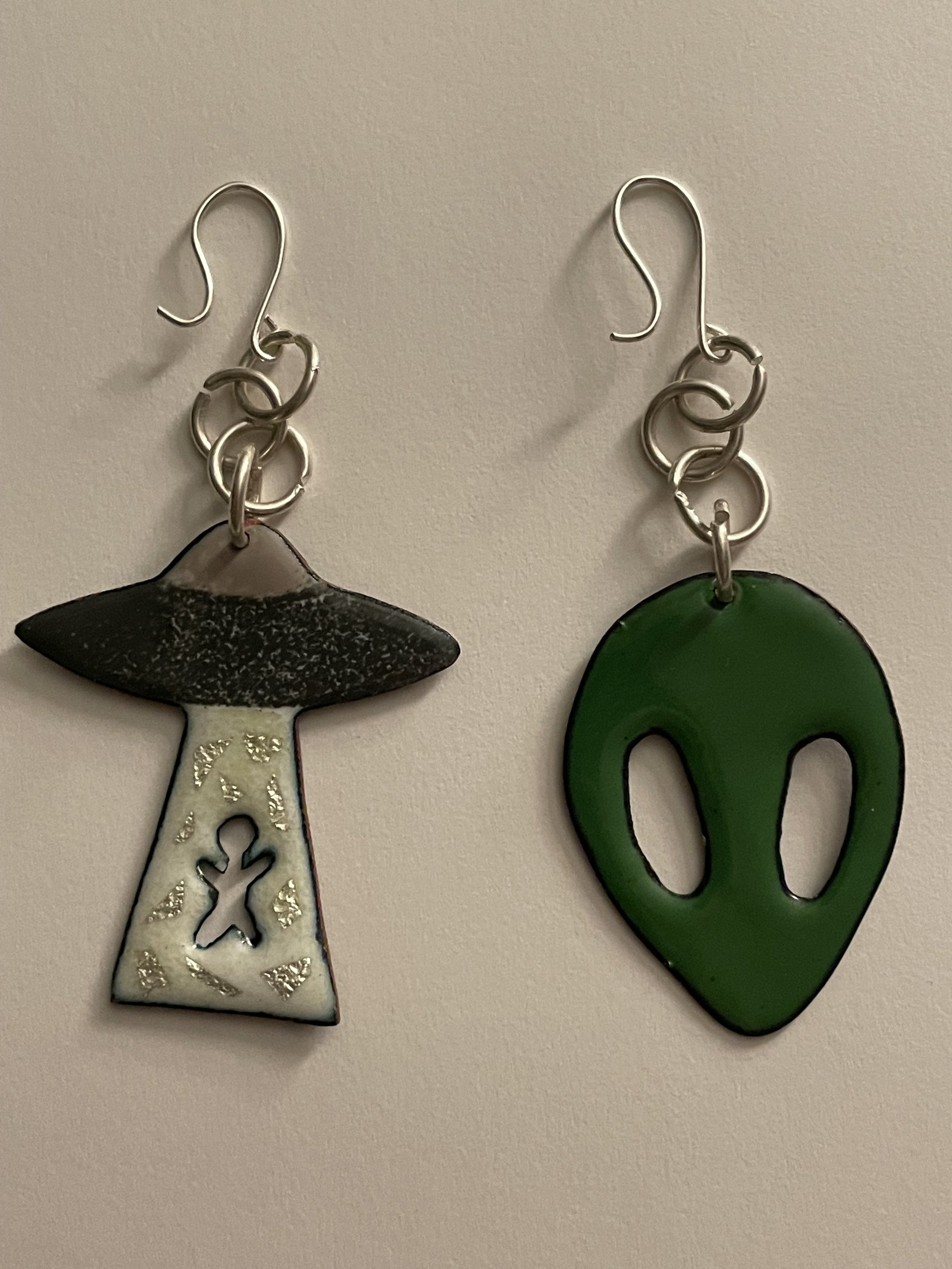 Abduct Me, 2022, enamel and silver hooks