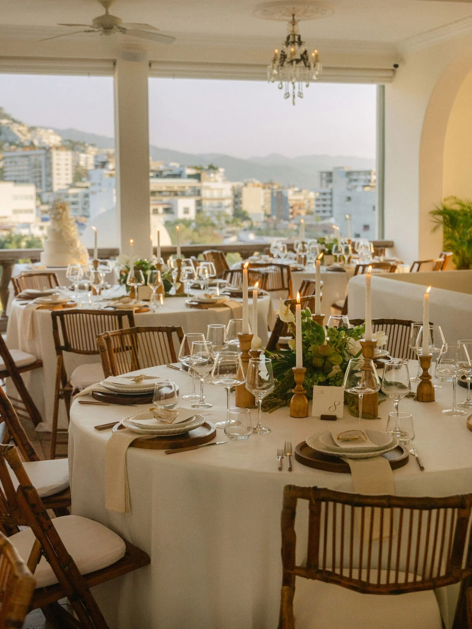 Reception tables on the terrace overlooking Puerto Vallarta at Casa Kimberly
