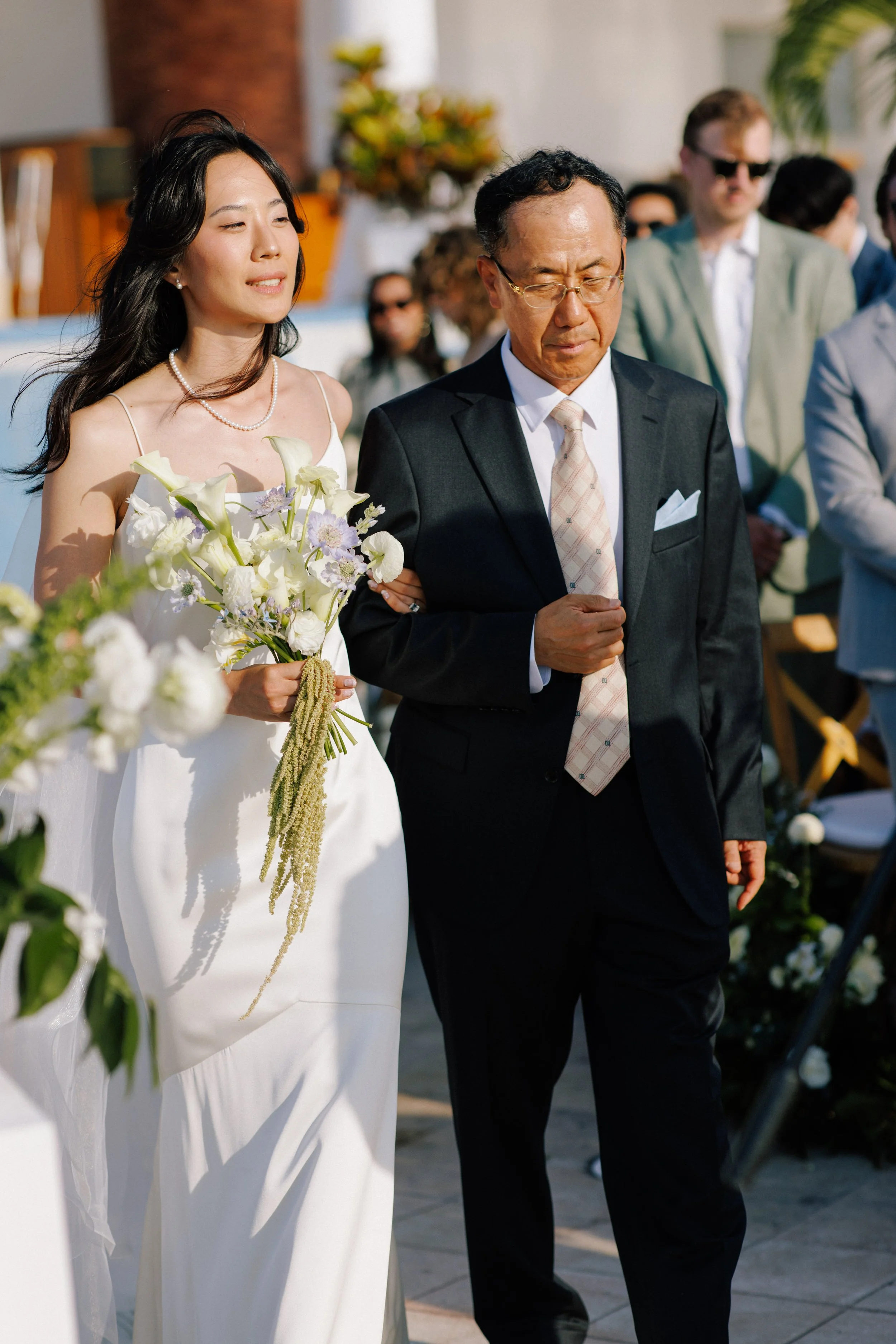  Bride walking down the aisle with her father at a Grand Miramar wedding 