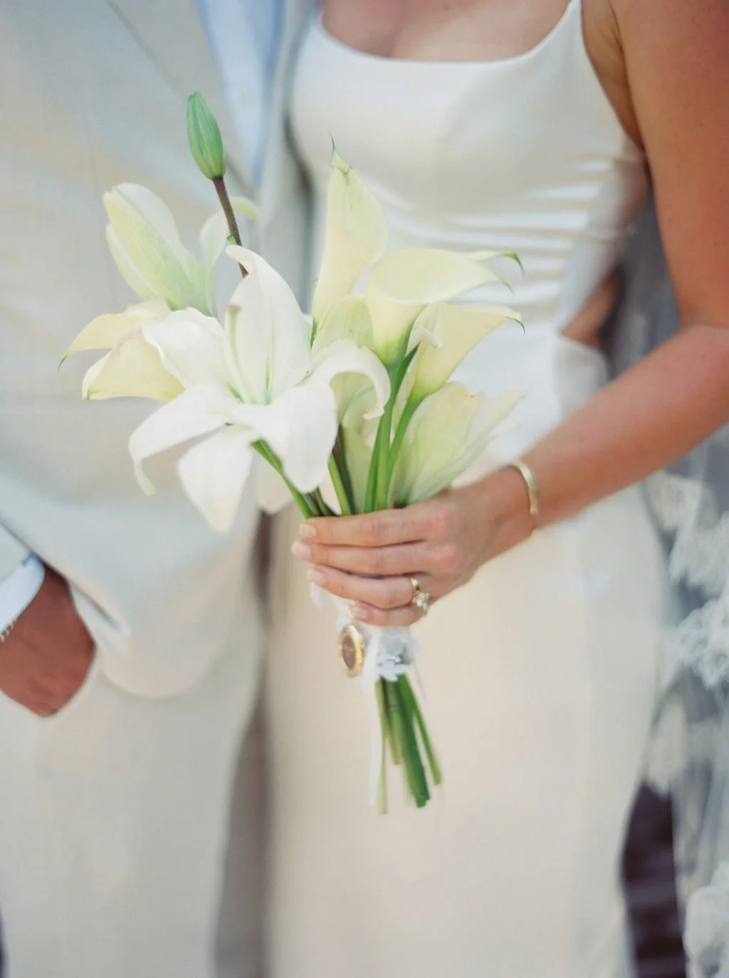 White calla lily bridal bouquet held by the bride at a Punta Mita wedding