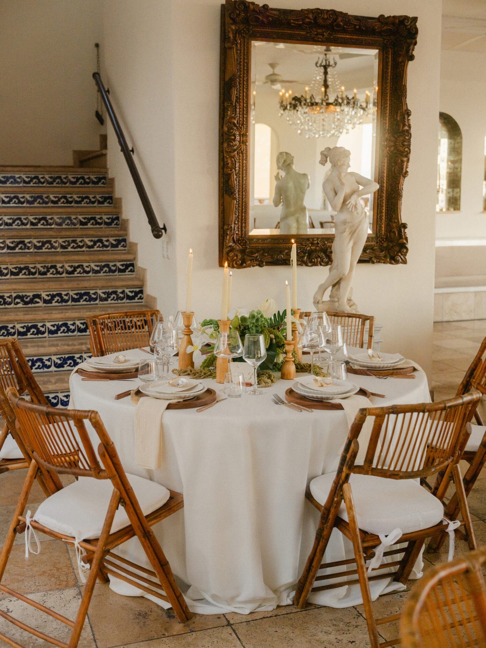 Reception table beside the talavera staircase at Casa Kimberly