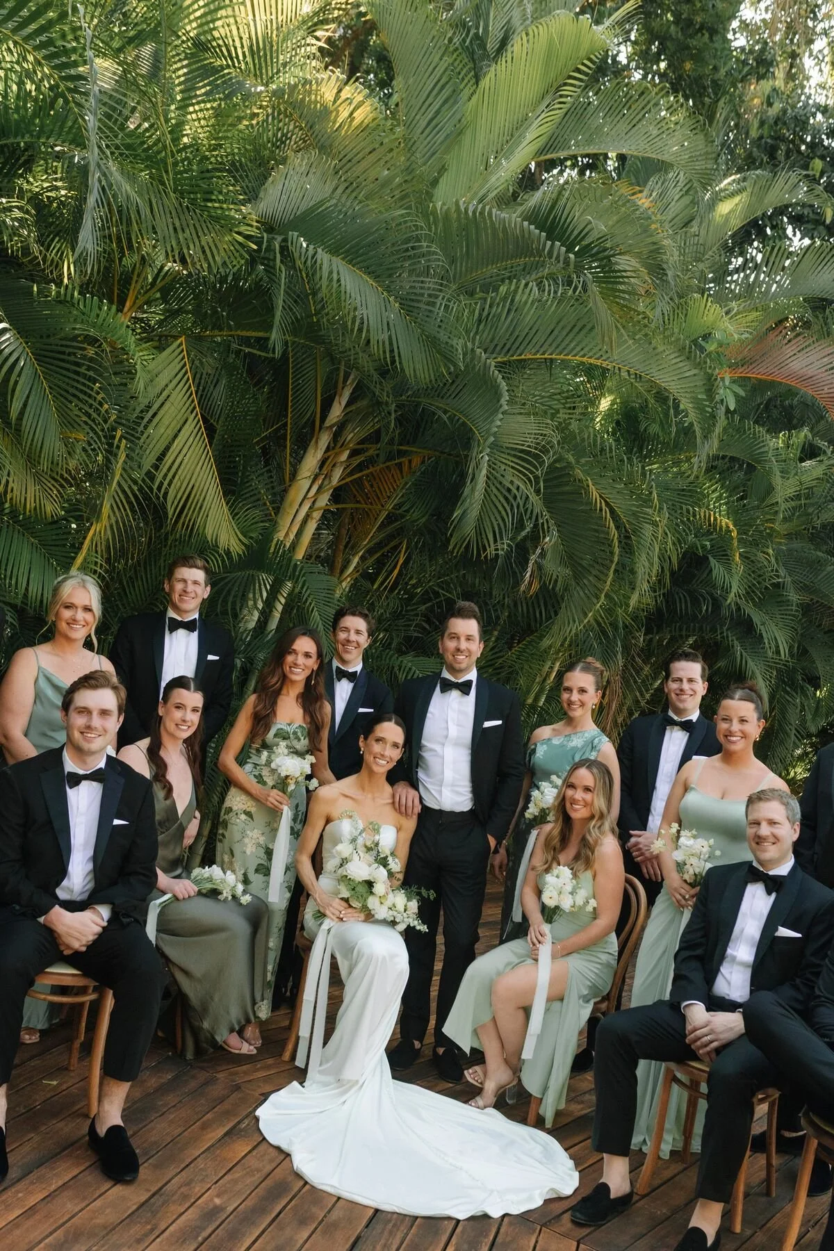 Wedding party portrait in black tie and sage green at Garza Blanca The Forum