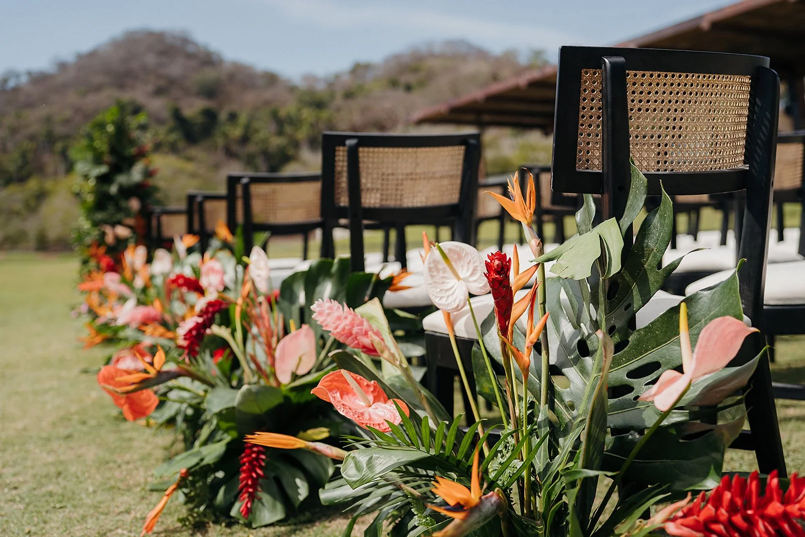 Coral anthurium, heliconia and bird of paradise at a Tierra Tropical Polo Club wedding