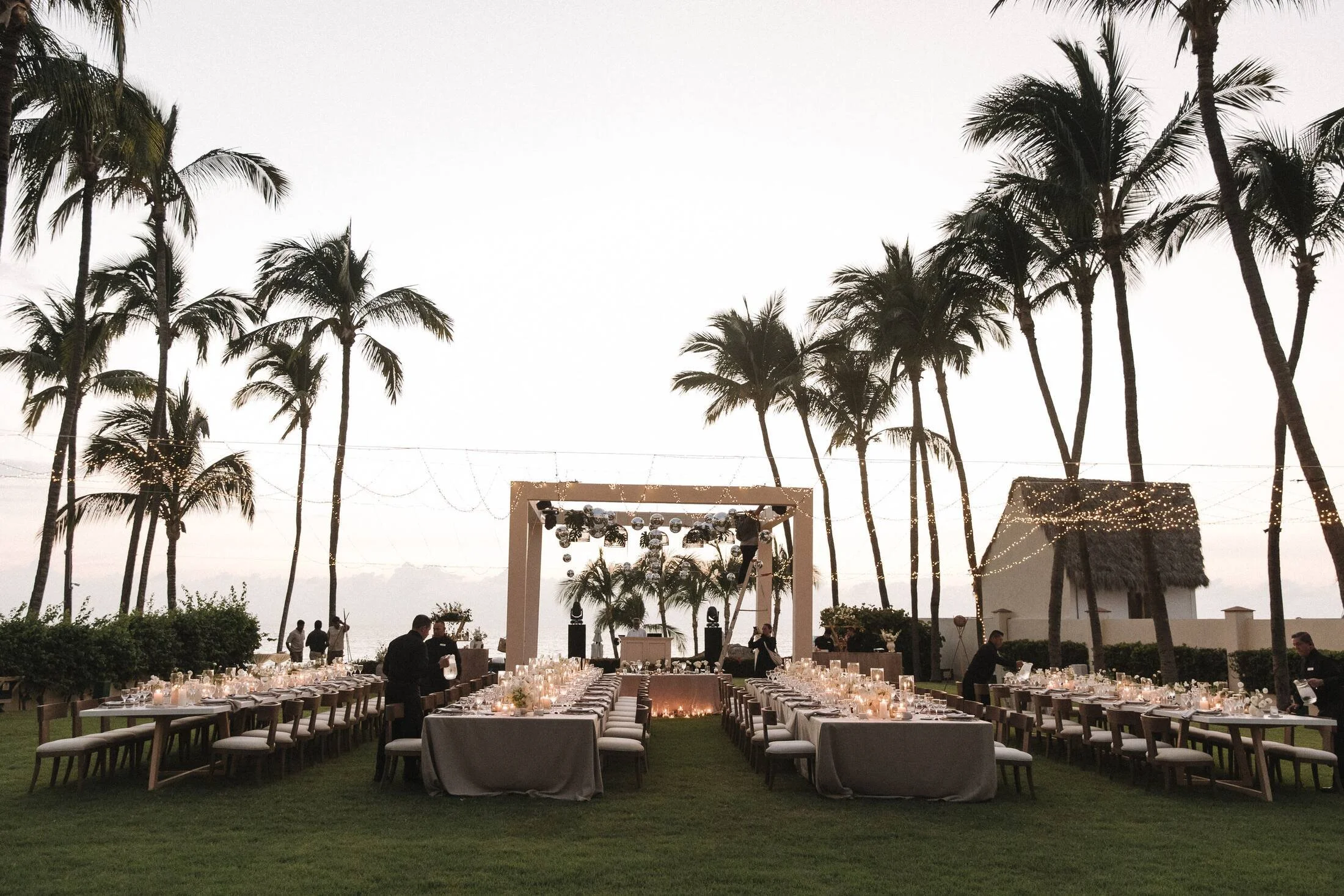Long tables on the lawn at sunset at Grand Velas Riviera Nayarit