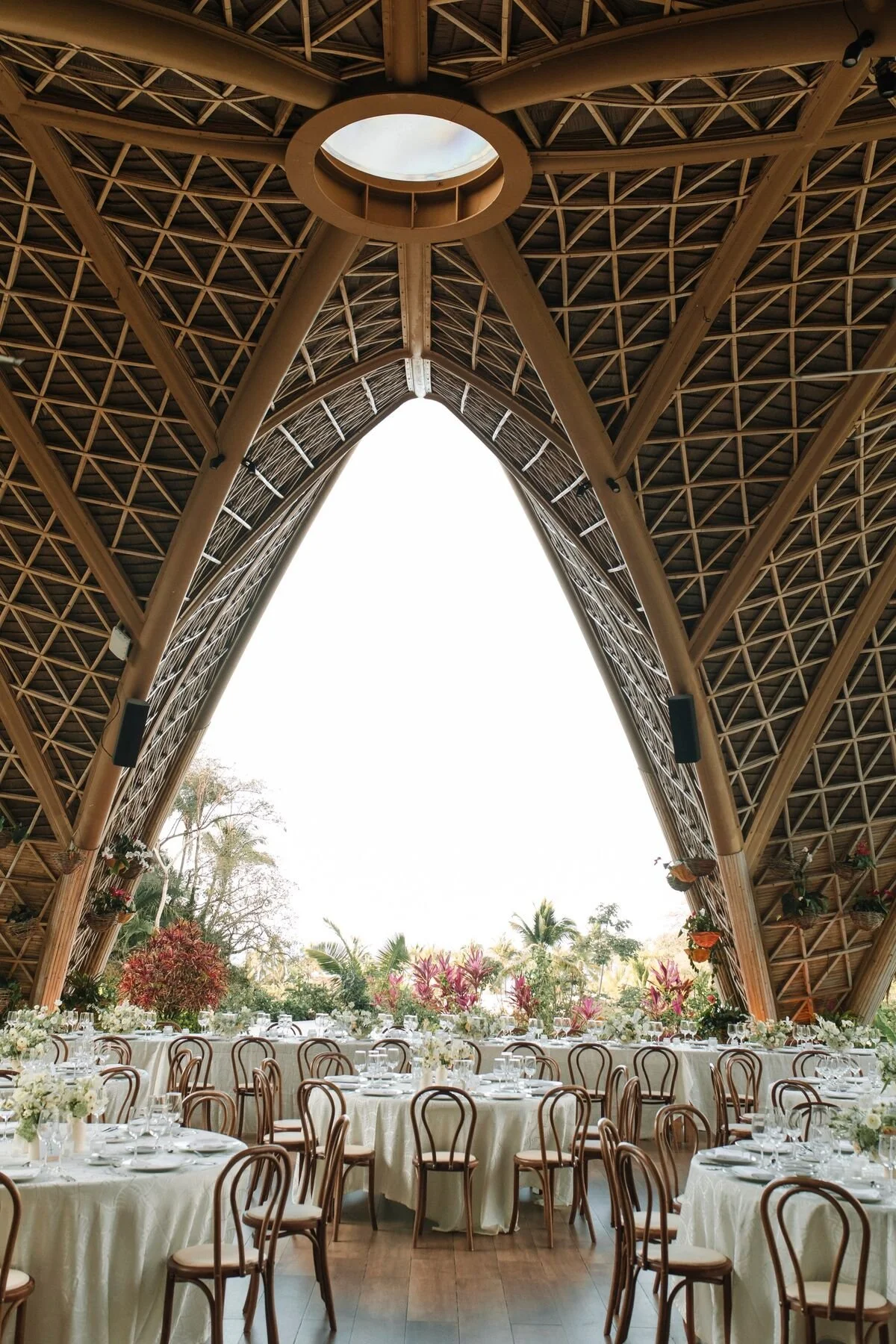 Reception set under the arched bamboo roof of The Forum at Garza Blanca