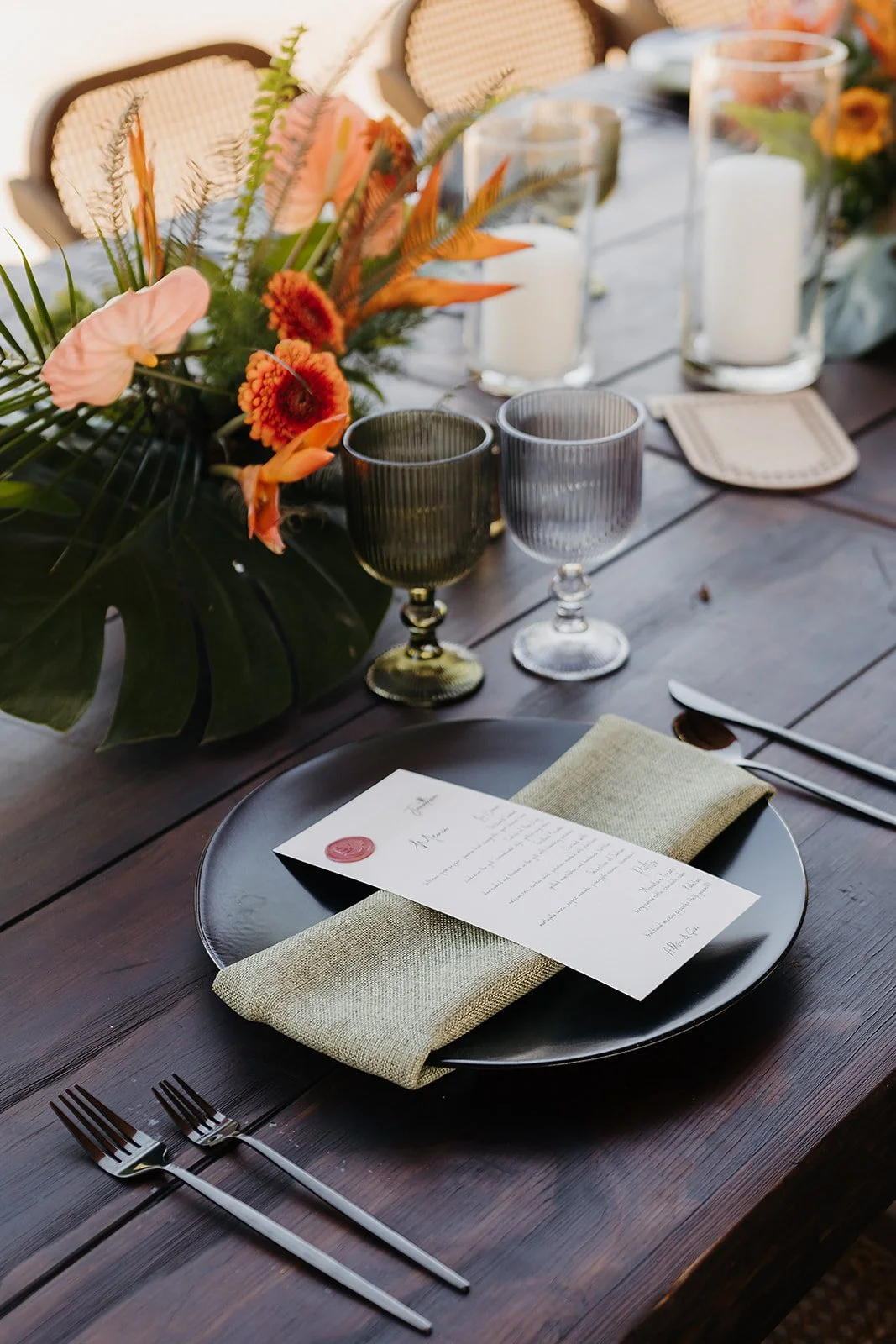 Place setting with menu and tropical centerpiece at Tierra Tropical Polo Club
