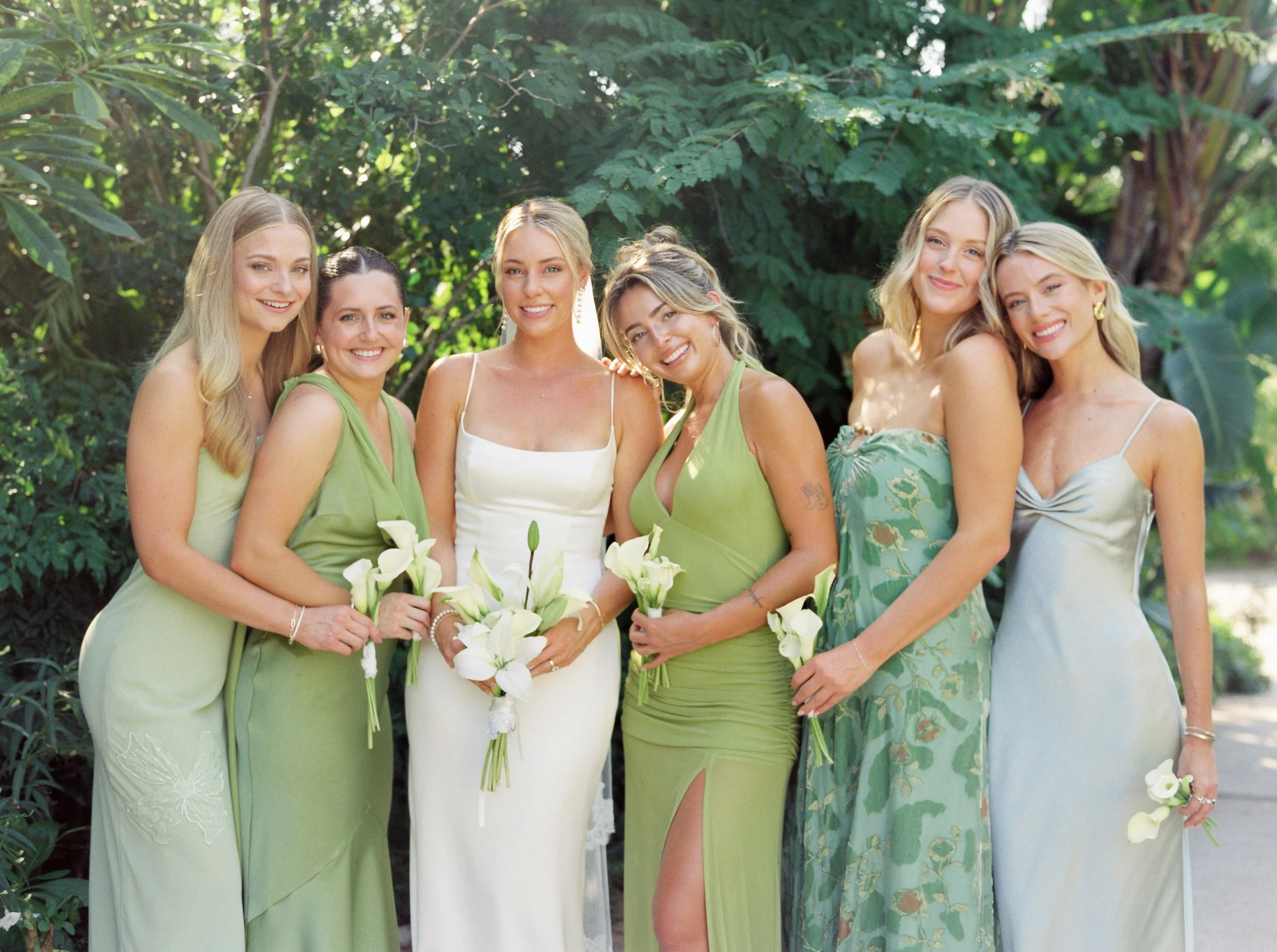 Bride and bridesmaids in green with white calla lilies at W Punta de Mita