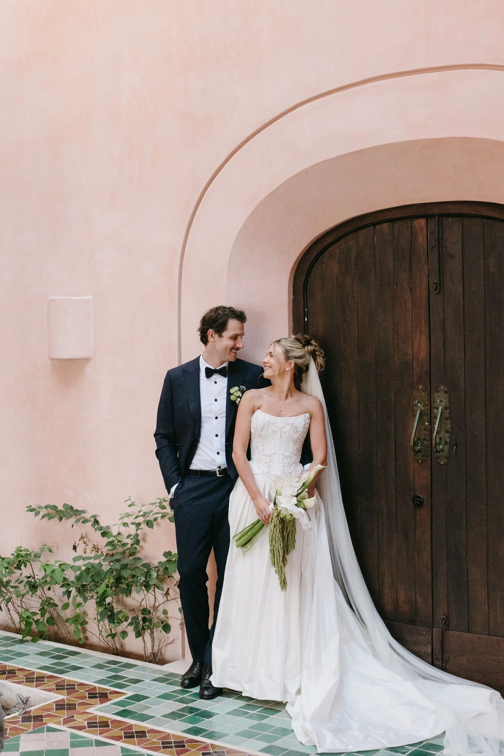 Bride holding a calla lily and green amaranthus bouquet at a Sayulita wedding