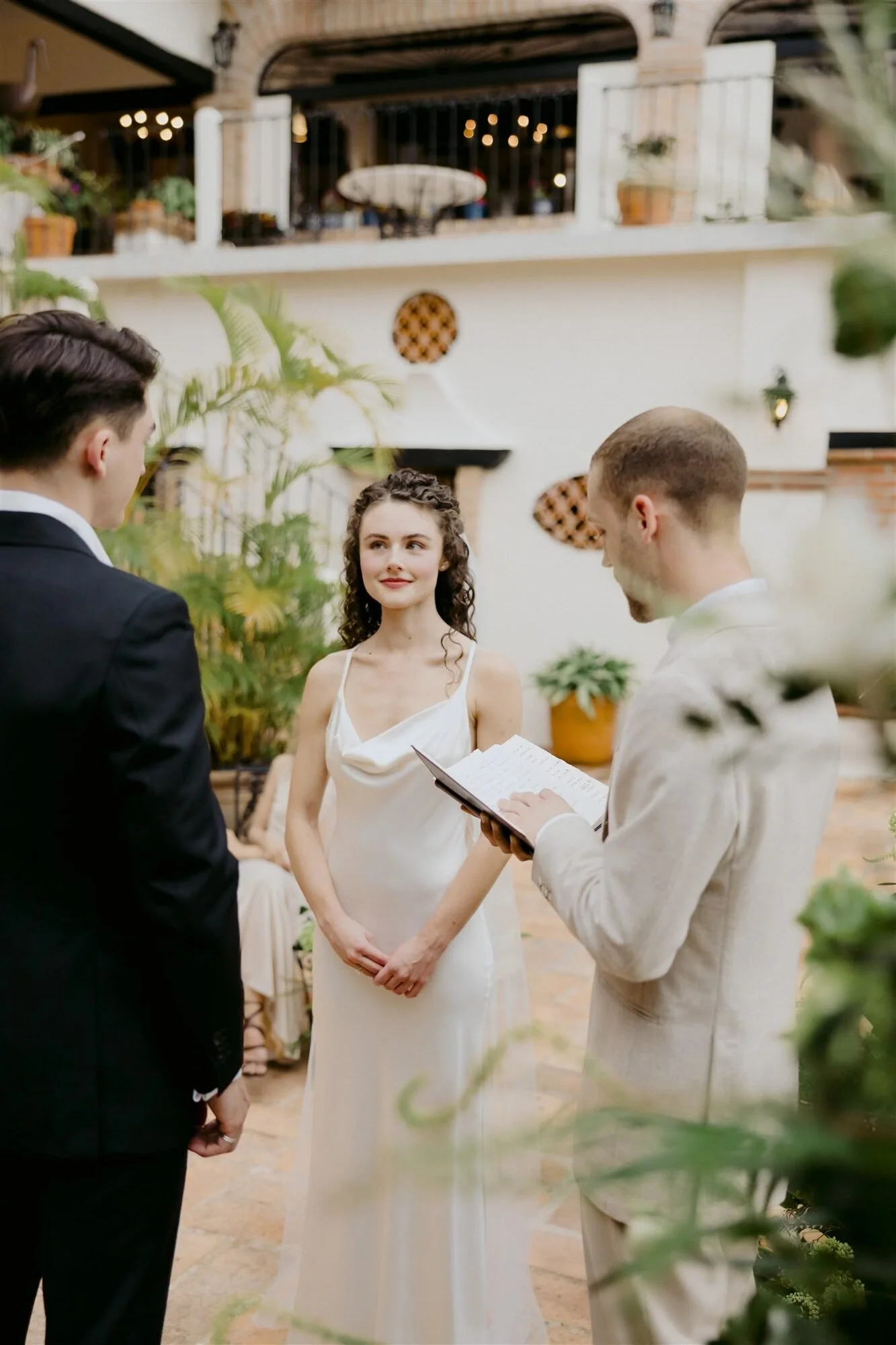 Wedding vows in the villa courtyard in typical Puerto Vallarta architecture at Quinta de Los Leones