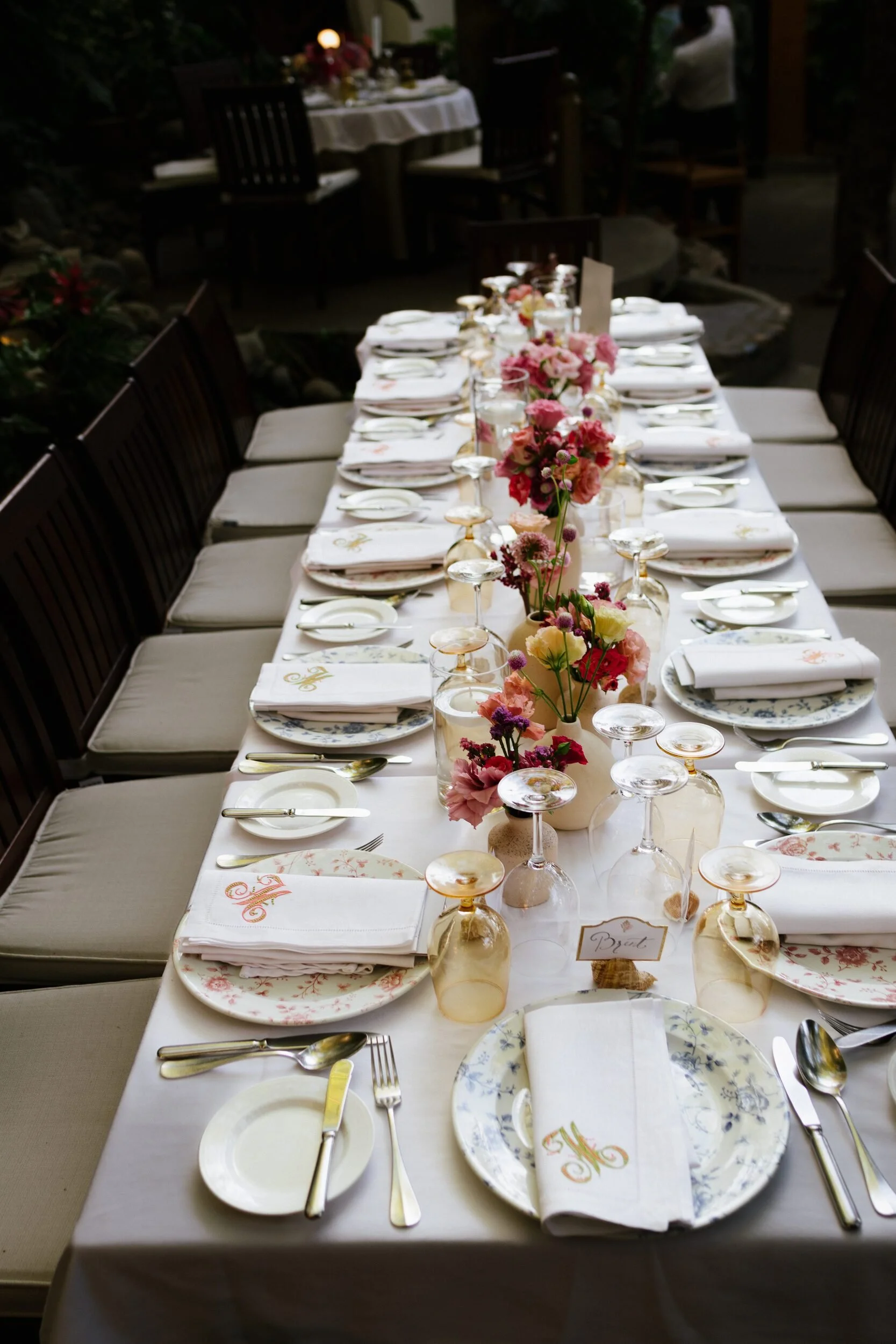 Rehearsal dinner long table with pink florals at Café des Artistes