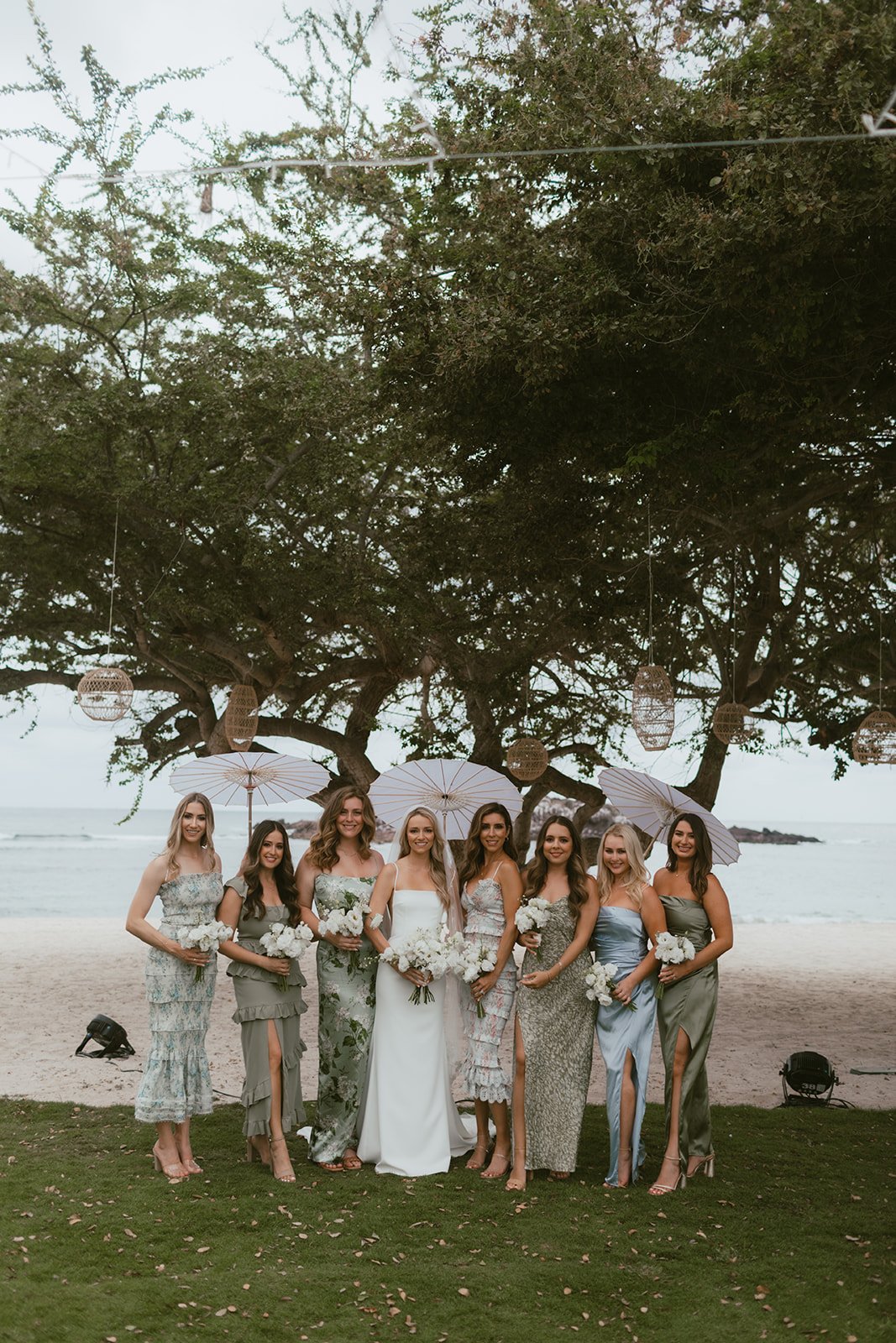 Bridal party under the ceremony tree with hanging lanterns, St. Regis Punta Mita