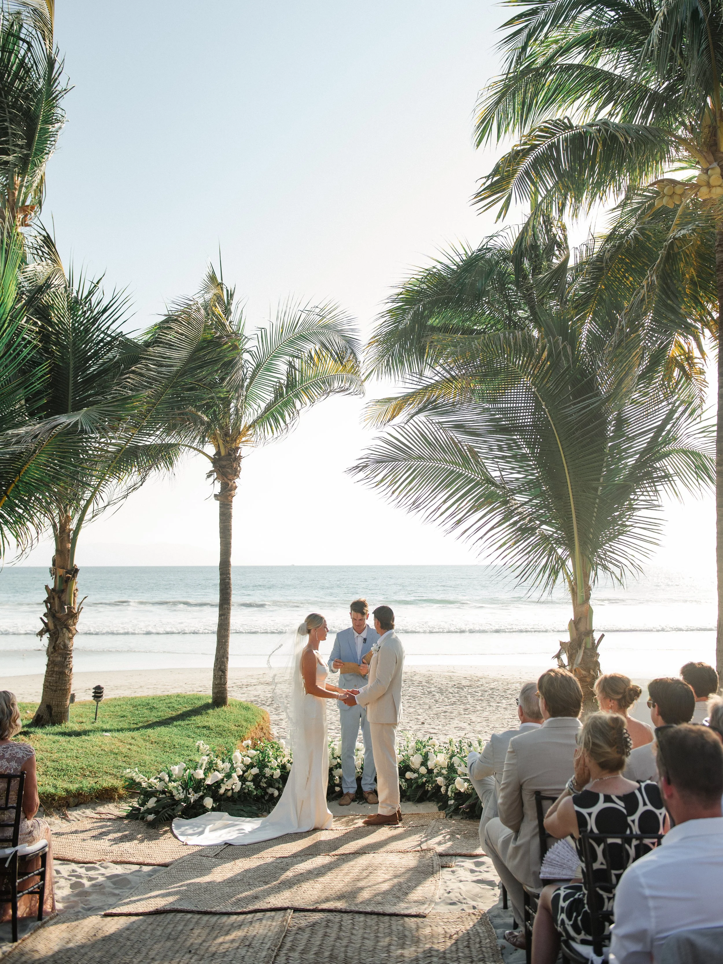 Ceremony aisle lined with grounded white florals at W Punta de Mita
